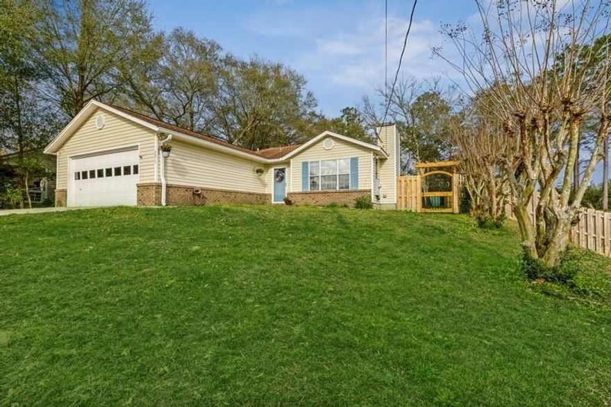 Welcome to this adorable and updated ranch home on the south end of Crestview! Once you walk in you are greeted with lovely living room with a tray ceiling and a cozy fireplace. Enter into the gorgeous eat in kitchen with stainless appliances. Walk down the hall to 1 full bath and 2 spare bedrooms, then to your master with an en suite bathroom. Outside in the backyard there is a great covered porch with new light fixtures. In the 2-car garage are the washer driver hook ups. The beautiful gate on right of house lights up at night. Don't miss out on this one, it will go quick!