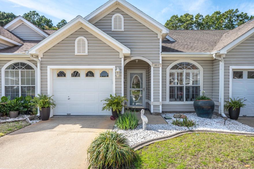 Beautifully updated townhouse! You'll enjoy the generously sized granite peninsula overlooking the open-concept living and dining area, making it a great place to entertain family and friends. There are far too many upgrades to name, but some of them are the gourmet kitchen with custom maple cabinetry, oversized pantries, and GE Monogram stainless steel commercial-grade appliances. Tile is throughout the downstairs, with bamboo flooring in the master bedroom, and continues up the stairway, which includes a custom-made maple banister and decorative rod iron. The master bedroom is located downstairs, suitable for a king-size bed, and comes complete with a full bathroom with garden tub, as well as a walk-in closet, two bedrooms, and a full bath upstairs. Plantation shutters throughout the hom