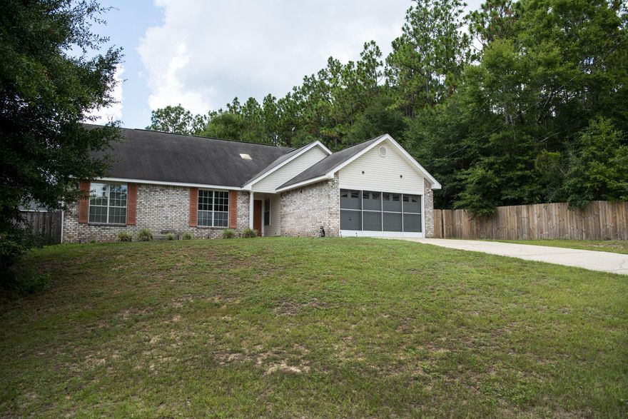 Motivated Seller! Beautiful home sitting on a large lot in a quiet neighborhood. The entryway opens to a large living area with vaulted ceilings. The upscale kitchen has gorgeous cherry cabinetry and quartz countertops. The fireplace begs for family time in the winter months. Separate dining room and office space are easily accessible from this area. A full bath and bedroom are just down the hall. The Large Master Bedroom Suite and bath are also located on the first floor. Upstairs you will find 2 more bedrooms, a bonus room, and a third full bath. A screened porch is just off the living room offering a relaxing spot to enjoy the large fenced back yard. The uniquely screened garage offers additional outdoor space. Children's Play Area and Sheds Convey. This house is ready for your family!