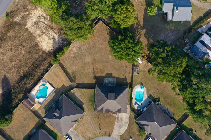 Welcome to your dream home in the Lee Farm subdivision! This spacious 5-bedroom, 3-bath all-brick home offers 2,820 square feet of beautifully designed living space and sits on one of the largest lots in the neighborhood--a flat, level 1/2 acre, fully enclosed with a privacy fence. Step inside to find exotic tigerwood engineered hardwood floors flowing throughout the foyer, living room, dining room, and breakfast area. All wet areas are upgraded with durable porcelain tile. The home boasts 9-foot ceilings, with crown molding enhancing the living, dining, kitchen, and breakfast spaces for an open, elegant feel. The kitchen is a chef's delight with 42'' raised panel cabinetry, granite countertops, matching granite backsplashes, and ample prep and storage space. Retreat to the spacious primary suite, complete with a private sitting area and a generously sized walk-in closet. The luxurious en-suite bath features a granite walk-in shower, separate soaking tub, and double vanities topped with granite counters. On the opposite side of the home, you'll find three additional bedrooms, plus a private guest suite with its own dedicated full bathroomperfect for in-laws or visitors. Upstairs, enjoy a large bonus room ideal for a media room, home office, playroom, or personal retreat. 

Additional Features:
All-brick exterior for low maintenance
Spacious layout ideal for families or entertaining
Community playground in the neighborhood
Conveniently located near schools, shopping, and dining

Don't miss this rare opportunity to own a beautiful home on one of the largest lots in Lee Farm. Schedule your showing today!