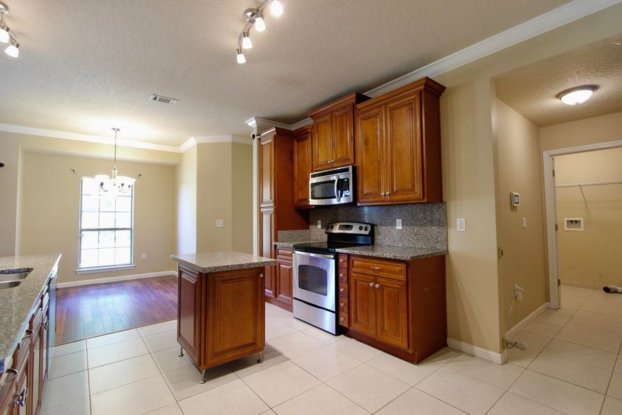 Welcome to your dream home in the Lee Farm subdivision! This spacious 5-bedroom, 3-bath all-brick home offers 2,820 square feet of beautifully designed living space and sits on one of the largest lots in the neighborhood--a flat, level 1/2 acre, fully enclosed with a privacy fence. Step inside to find exotic tigerwood engineered hardwood floors flowing throughout the foyer, living room, dining room, and breakfast area. All wet areas are upgraded with durable porcelain tile. The home boasts 9-foot ceilings, with crown molding enhancing the living, dining, kitchen, and breakfast spaces for an open, elegant feel. The kitchen is a chef's delight with 42'' raised panel cabinetry, granite countertops, matching granite backsplashes, and ample prep and storage space. Retreat to the spacious primary suite, complete with a private sitting area and a generously sized walk-in closet. The luxurious en-suite bath features a granite walk-in shower, separate soaking tub, and double vanities topped with granite counters. On the opposite side of the home, you'll find three additional bedrooms, plus a private guest suite with its own dedicated full bathroomperfect for in-laws or visitors. Upstairs, enjoy a large bonus room ideal for a media room, home office, playroom, or personal retreat. 

Additional Features:
All-brick exterior for low maintenance
Spacious layout ideal for families or entertaining
Community playground in the neighborhood
Conveniently located near schools, shopping, and dining

Don't miss this rare opportunity to own a beautiful home on one of the largest lots in Lee Farm. Schedule your showing today!