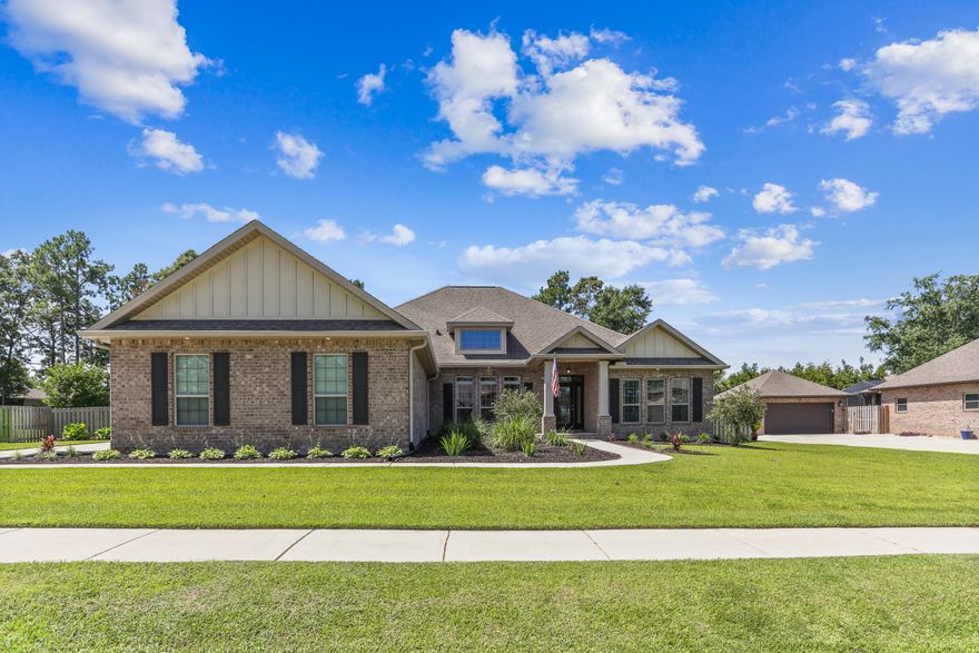 Welcome to this meticulously maintained 4 bedroom, 3 bath brick pool home with a dedicated office and 3 car garage, ideally located in the highly desirable Ashley Plantation neighborhood. This spacious and elegant home is truly move-in ready and perfect for your next chapter. Step through the front door into a welcoming foyer. To your right, a private office or study features beautiful custom-built bookcases, while to the left, a formal dining room offers ample space for entertaining. The home's open layout connects the foyer to a spacious great room and gourmet kitchen, creating a seamless flow ideal for everyday living and gatherings. The great room features double tray ceilings, crown molding, and opens directly onto the screened lanai. The chef's kitchen is a showstopper, boasting granite countertops, a large island, two pantries, and updated GE Profile appliances, including a double oven, microwave, and refrigerator. The luxurious master suite is a true retreat, with plenty of space for a king-size bed and sitting area. The en suite bathroom includes a huge walk-in closet, double vanities with granite countertops, a garden tub, separate shower, and a private water closet. Enjoy views of the pool and direct access to the lanai from your master bedroom. On the opposite side of the home, three additional bedrooms offer generous closet space and are serviced by two full bathrooms. Step outside to your private backyard oasis, ideal for entertaining or relaxing. The gunite, saltwater pool features crystal-clear water, a tanning ledge, and is surrounded by custom landscaping within a fully fenced half-acre lot. The screened lanai opens to the pool deck via sliding screen doors, blending indoor and outdoor living effortlessly. Additional features include a concrete boat parking pad behind the fence, gutters and accent lighting, upgraded fans and lighting fixtures, and Hurricane protection panels for peace of mind. Schedule your showing today!