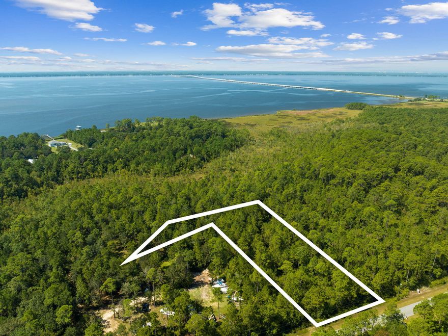Rare 7.25-Acre Development Opportunity for Small Subdivision or Private Community.Privacy, acreage, and nature this 7.25-acre parcel offers a prime opportunity for a small subdivision, family compound, or boutique community. With uplands and an X flood zone, the property is high and dry, making development seamless. Zoned Rural Village, it allows for two units per acre, supporting up to 14 homesites while preserving the natural beauty of the land.Featuring 300 feet of frontage on Jolly Bay Road, this property provides both accessibility and seclusion. Residents will enjoy magnificent sunsets over Fluffy Landing, a peaceful slough that enhances the charm of this Old Florida landscape. Surrounded by century-old oaks, magnolias, and native palms, its a tranquil retreat just minutes from 30As world-class beaches, dining, and entertainment.

Rich in history once home to an old sawmill and ferry landing to Point Washington????"this land offers a unique blend of heritage, convenience, and opportunity. As an added perk, a neighborhood dock provides easy access to the water for fishing, kayaking, or simply unwinding in nature.

Whether you envision a private estate, a multi-generational homestead, or a thoughtfully designed residential community, this property delivers endless possibilities in an unbeatable location.

Seize this rare chance to create something truly special!