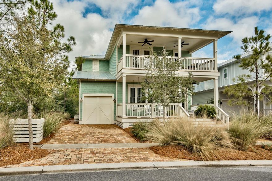 This amazing four-bedroom, four-and-a-half bath home with one-car garage is for sale and is nestled next to two preserve areas in NatureWalk at Seagrove in beautiful South Walton, FL. This home has numerous upgrades to the interior and exterior, including hardwood floors, screened back porch, built in bunk beds, cabinets and much more. The deep front porch welcomes you as you walk up to the home. Inside you'll find a formal dining room to the left and a half bath on the the right. The kitchen, living room and another dining area are all open and perfect for entertaining and family get togethers. The kitchen has stainless appliances that include an ice maker, built in microwave, granite countertops, tile backsplash and a hot water dispenser.The living room has speakers in the ceiling and