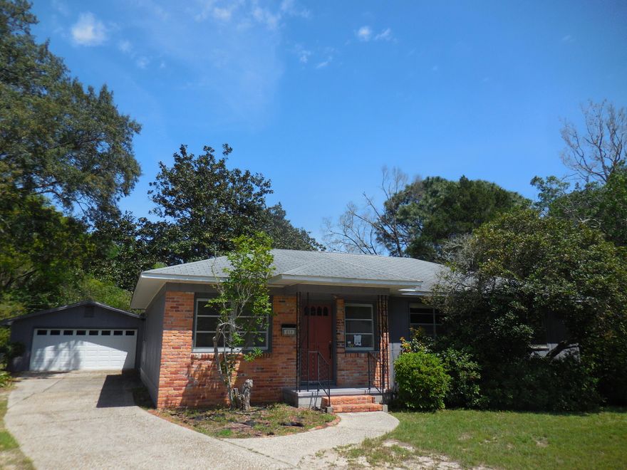 REO Lovely 3 bedroom, 2 bath home with unique charm and fetures you will not find in most homes. The tax rolls list it as an Actual Year Build 1943, with and Effective Year Build of 1965. Each of the 3 bedrooms offer unique built-ins and the hall way has beautiful glass fronted shelving. The kitchen features a passage window to the living room and a breakfast bar. You will also find a clever spice rack next to the pantry. The home has a large living room and a family room, both of which can also share room with a dining table. Off the family room is a good sized bonus room, perfect for projects or storage. Detached from the house, but right next to it, is a large 2-car garage with built-in closets and workbenches. The yard is large and has lovely trees. The 25x15 deck is perfect for BBQs!