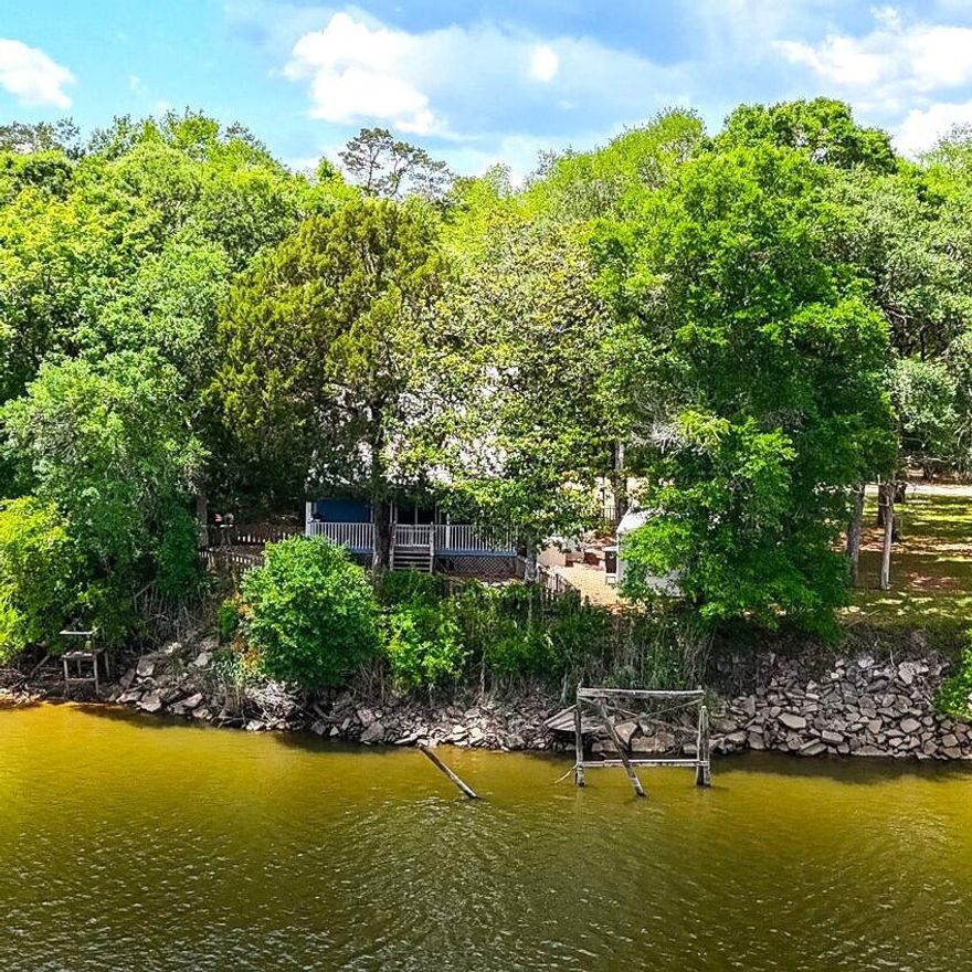 Rare Riverfront Opportunity on the Choctawhatchee!Don't miss your chance to own this unique 3-bedroom home perched on the tranquil banks of the Choctawhatchee River. Whether you're looking for a serene primary residence or the ultimate fish camp getaway, this property offers the best of both worlds. Just seconds from the nearest boat ramp, you'll have quick and easy access to endless days on the water.Enjoy peaceful, uninterrupted views from the back porch and living room, where nature becomes part of your everyday experience. Located just 20 minutes from Panama City Beach, you can enjoy the quiet of riverfront living without sacrificing convenience. This is a rare find in an unbeatable location--act fast!