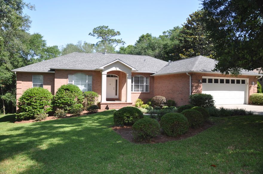 Large 4 bedroom and 3 bath family home with two living areas. A large living room with a gas log fireplace and a 16x14 foot den with a raked wood floor and a cathedral ceiling. There is a formal dining room with an 11 foot trey ceiling. The large kitchen has white wood cabinets, and abundant counter space and a serving bar area. The breakfast area is next to the kitchen and has space for a large family table. The Bedrooms are split with the master suite on the right side of the house and the other bedrooms on the far left side. The home has a wide wood deck across the back of the house with a covered area for a table and chairs. The wooded lot is very private,located on a Cul-de-sac with an open area. This home had a new roof in Oct,2012. Don't miss seeing this Rocky Bayou home.