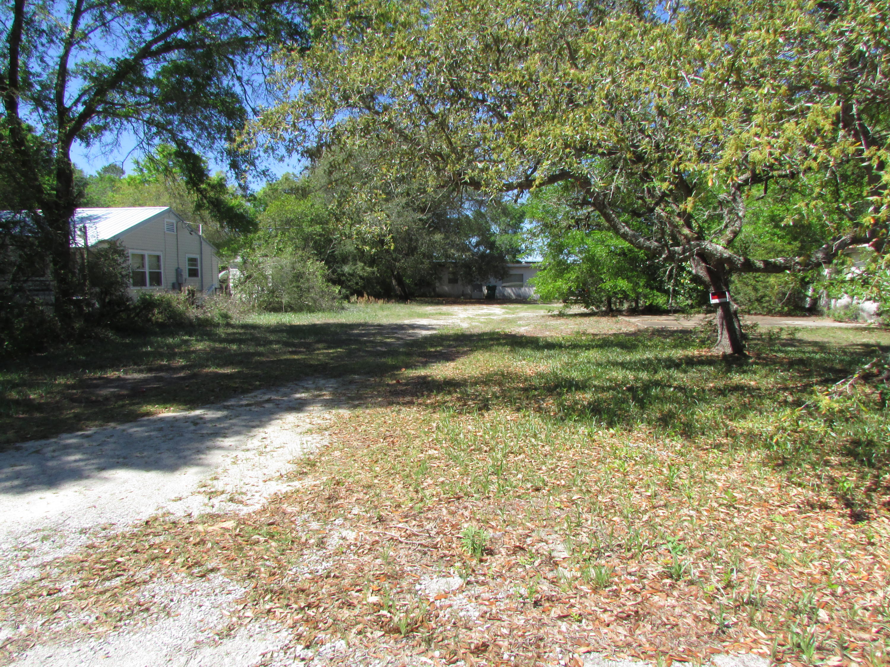 Property boasts breath-taking mature trees located in tranquil Fort Walton Beach, Florida. Build a new home or renovate the two existing structures. You have 0.67 acres to work with. Currently Zoned R-2.