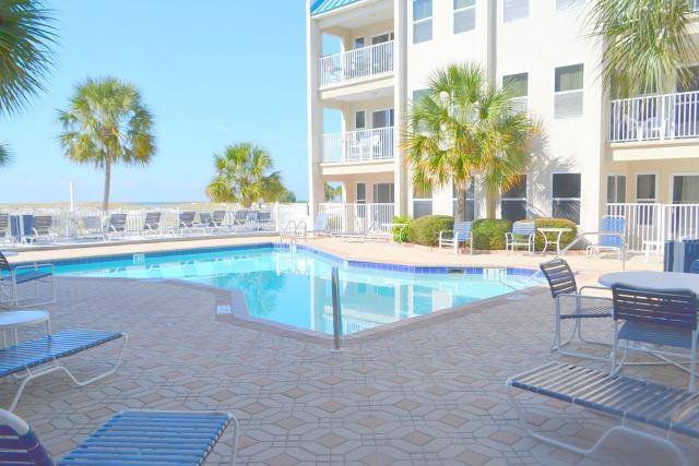 On Holdiday Isle, the complex (Poolside Villas) only has three floors. Walk straight out the front door to the fresh water pool! Washer dryer in the unit. The unit has 2 bedrooms and 2 baths, being sold fully furnished! Located within minutes of downtown Destin, and the airport. Outlet malls, water park, deep sea fishing, and world class golf are but minutes away. Cinemas, putt-putt, boat rental, boutique shops, arcades, go carts, jet ski rental,and para-sailing are all located in close proximity.