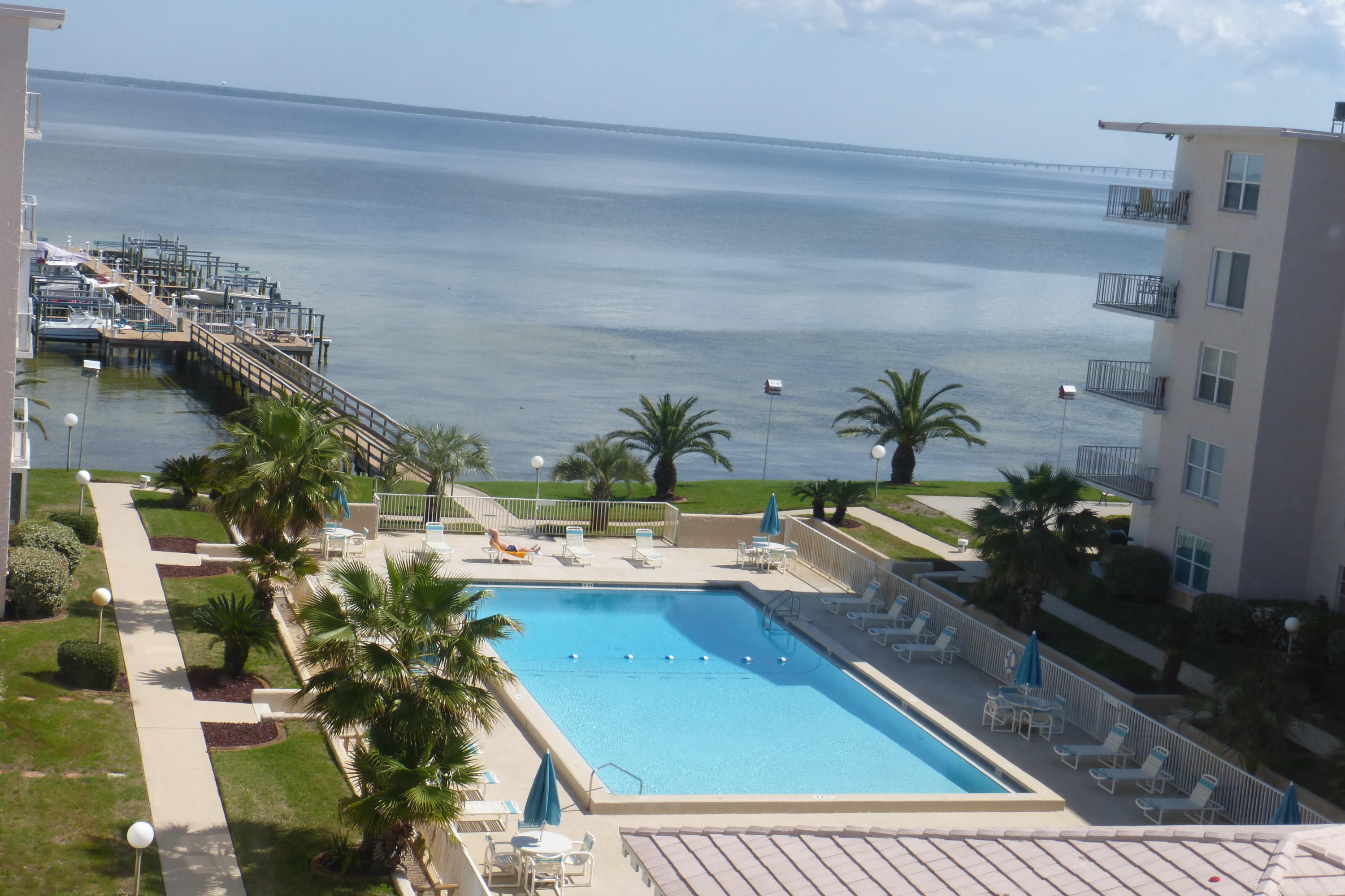 Perfect location on the Bay. Quiet & peaceful surroundings. Spacious two bedroom, two bath condo. Newer kitchen some updates. This is a resident building. No short term rentals. Amenities Include: Pool, social room with a kitchen, fishing, boat storage, owner storage, shuffle board. Buyer to verify all room dimensions. Priced to Sell.