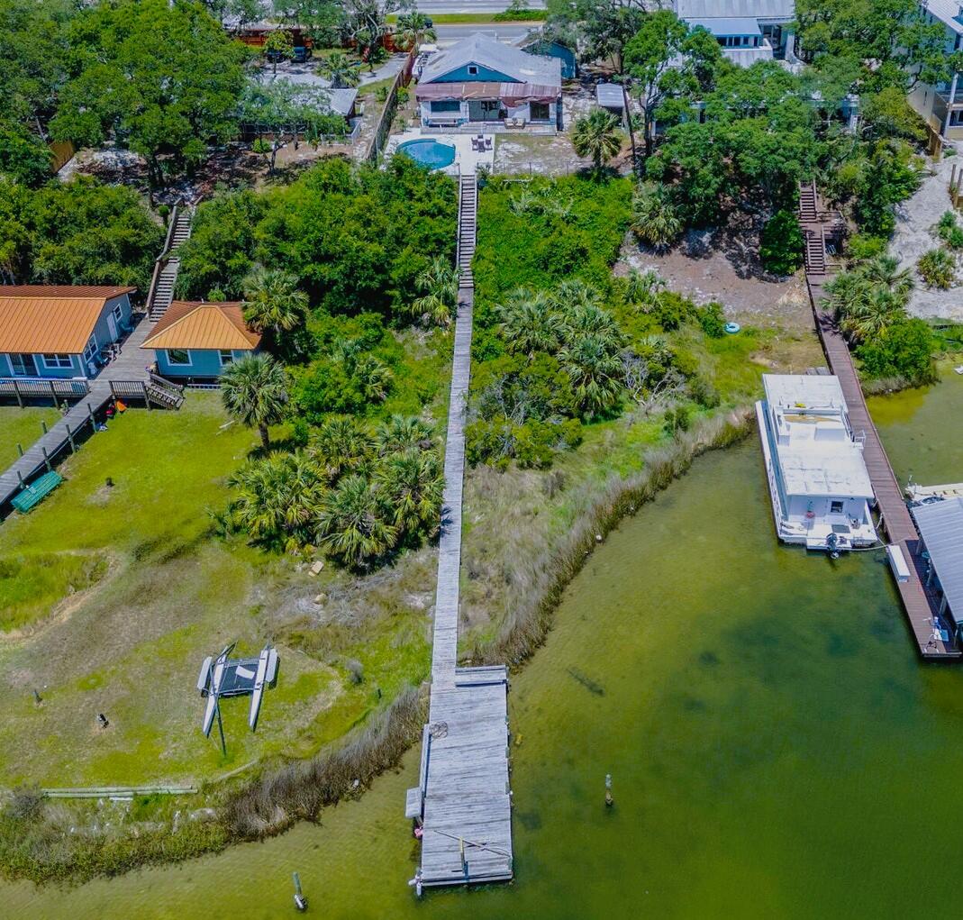 Harbor Living on this beautiful lot, this home is ready for a complete remodel for your own style. This home has been taken down to the studs and ready for your own remodeling touches. There is a home with 1344 sq ft and a guest house with 317 sq ft.