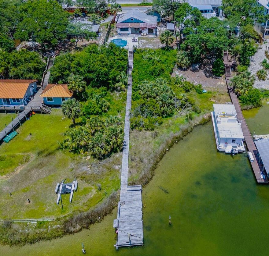 Harbor Living on this beautiful lot, this home is ready for a complete remodel for your own style.   This home has been taken down to the studs and ready for your own remodeling touches. There is a home with 1344 sq ft and a guest house with 317 sq ft.