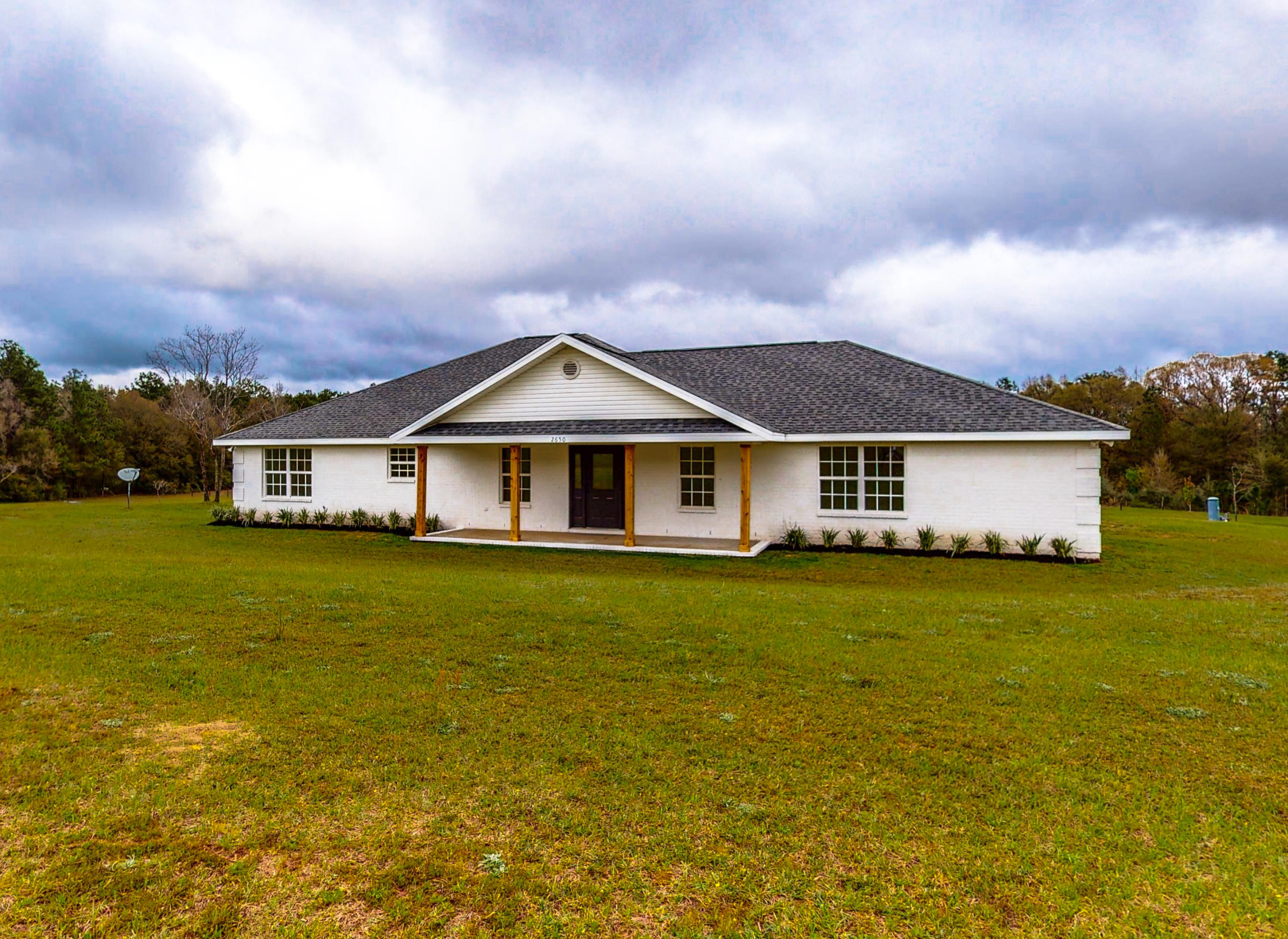 Welcome to peace, quiet, and country living! Bring your animals to this property which features a newly renovated and completely updated 5 bedroom 3 Full Bath home that was custom built in 2006 all on a full acre. Almost everything inside is brand new including HVAC, luxury vinyl plank flooring, updated cabinetry and granite/marble counter tops in kitchen and bathrooms, stainless appliances, tile back splash, custom ship lap wood on breakfast bar and new fixtures throughout. All bathrooms feature updated hardware/fixtures as well as newly finished shiny white fiberglass inserts - master bath has a shower and separate tub. Large porches at the front and rear of the home with a nice country view. All room dimensions are approximate, buyers/agents to verify.