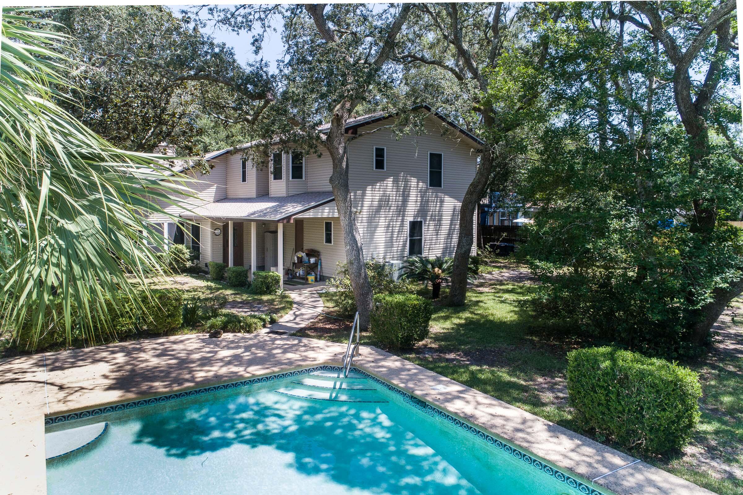 This is it! A large family home ready for your family! Big lot (over 1/3 acre) with a sparkling pool in the beautiful back yard, full of oaks and magnolias. This spacious home is ready for your updates and personal touches. But it already has the beautiful pool, one year old water heaters, and a brand NEW ROOF with full warranty to the buyer! So much space inside and out! Cozy den with tongue-n-groove pine walls and cool retro 70's corner fireplace. Double french doors separating the den and sun room. A room for everything: den, separate living room, sun room, five bedrooms (with downstairs master!), hobby room, study, so many possibilities, and lots of storage! So much house for the money - don't let this one slip away!