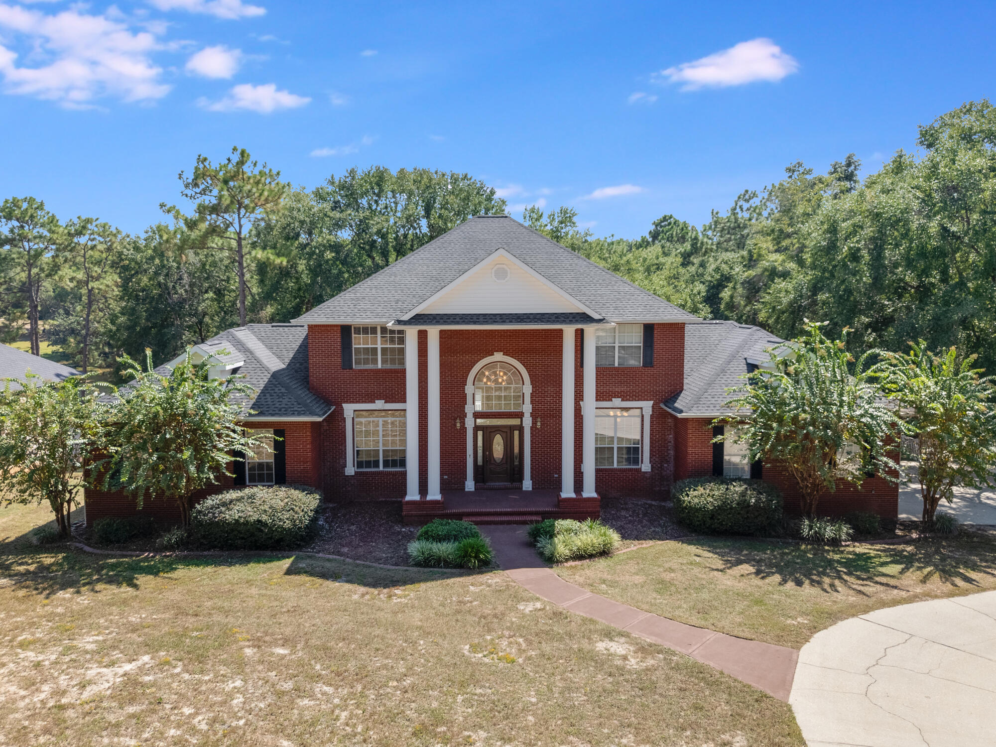 This spacious lakefront estate in North Crestview is a MUST SEE!!! Sitting on a large 1.4 acre lot on Ridge Lake, this home has it all. A total of 7 bedrooms, 4.5 bathrooms, multiple flex spaces for work and play along with a spacious 3 car garage and lots of parking. This home has a large basement that has its own kitchen, living areas, and its own entrance. All major systems have been updated including new roof, 3 new AC units, and 2 Water Heaters. Enjoy the fishing and sunsets on your private dock on Ridge Lake! Priced to make it your own. Don't miss this ''forever home''!