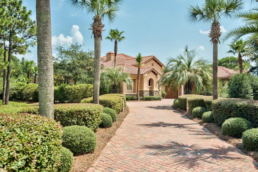 The Burnt Pine at Sandestin lifestyle welcomes you to 3274 Burnt Pine Circle. Nestled on an oversized corner lot in a quiet and private cul-de-sac, this home is surrounded by the impeccably groomed Burnt Pine Golf Course with direct views of the #17 fairway and green and #18 tee box and fairway.The long, private drive, lined on both sides with majestic palms, leads you to the grand entrance of this home, highlighted by an arched stone entryway that welcomes you through the double leaded glass doors into the open and airy interior. Once inside, you are immediately aware of the quality craftsmanship that went into this Maurice Sweet built home. The mosaic tiled foyer invites you to step inside and be swept away by the glorious views of the golf course through a mitered glass bay of floo