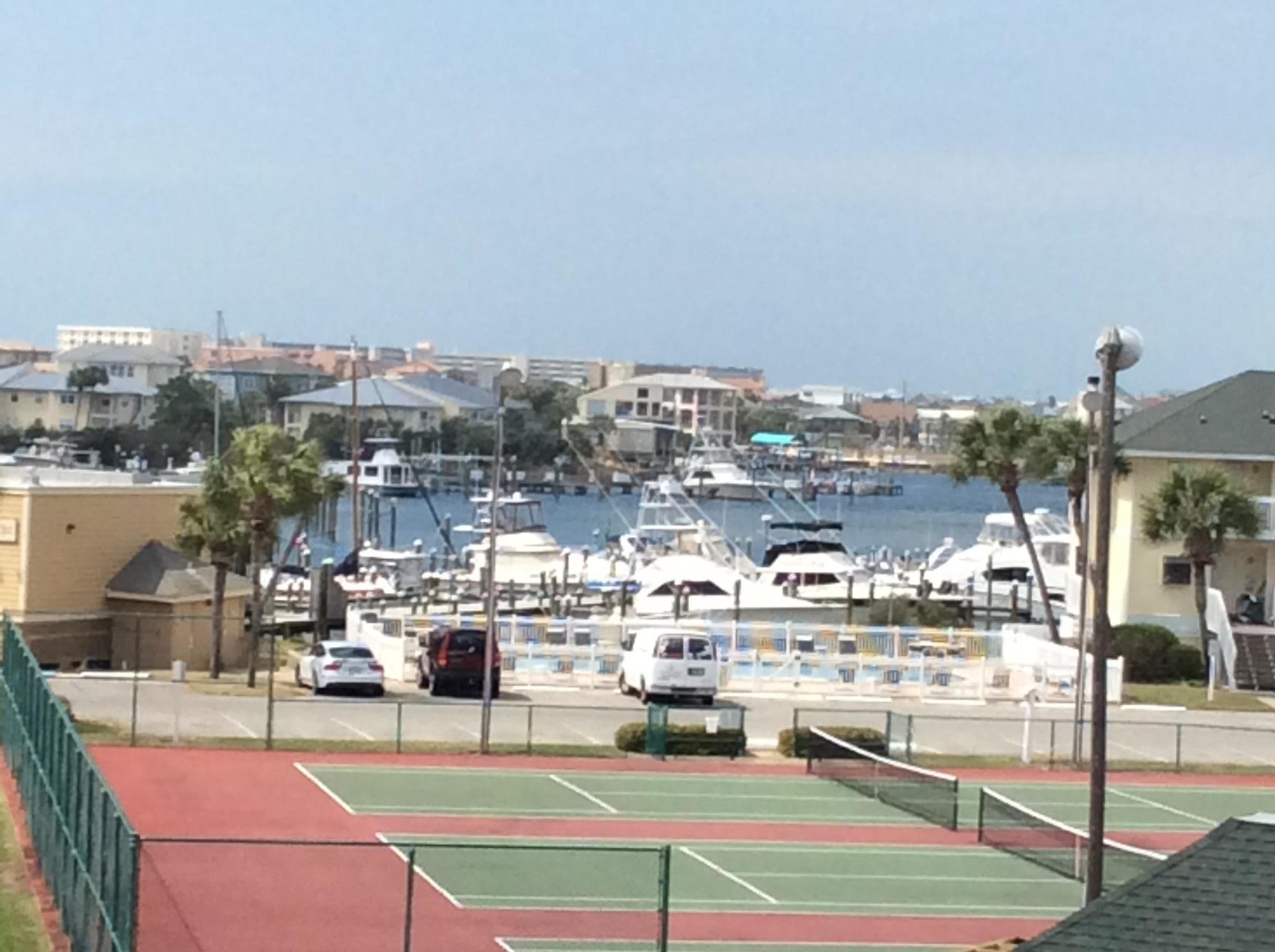 Great 2 bd/2 ba condo centrally located in SPC. Just steps from the canal, tennis cts, Harbor and Harborfront pool, and a short walk to the beach and other SPC amenities. Owner has made numerous updates and renovations including granite counter tops, Pergo flooring, and 2 extra windows on the west side of the bldg for added light and views. SPC is a low density residential style resort occupying 43 acres in the heart of downtown Destin. Favorite amenities include 1100 ft of beachfront w/seasonal beach service and Rick's Beach Bar and Grill, 5 pools, 6 tennis courts, canal boat docking/ by reservation, private marina slips for long term larger boats, and the favorite 9 hole par 3 pitch and putt golf course. Don't miss this one!