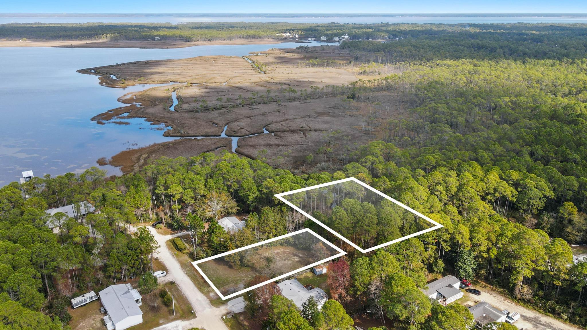 Total of 6 lots offering some water frontage on canal. Possible water views! Beautiful location for a private residence or development - up and coming area of Santa Rosa Beach.