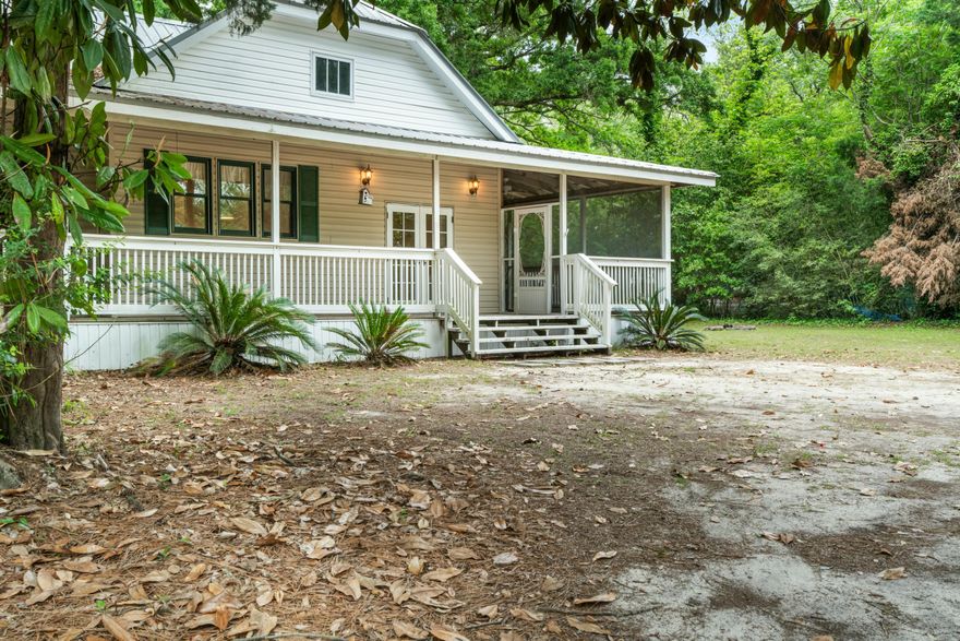 Florida Southern Cottage style home with tall 10 feet interior ceilings and Large L shaped outdoor partially screened Porch area. 2359 sf under roof total. 2 large bedrooms and 2 baths.Laundry room is in home in back area next to master room and access from screened porch area as well. There is a large Den area or Formal entry that is a host that could easily be used as an addition Bedroom or office. Also there is a large unfinished area in the attic that possibly could be used for extra storage . Beautiful property with large oaks surround and very charming.