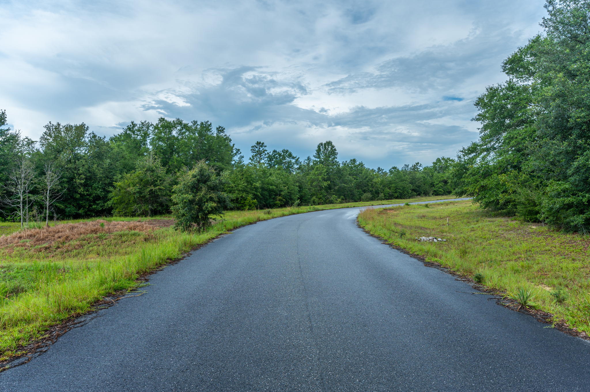 This property is a paradise for farming enthusiasts! With endless opportunities to build your dream home and enjoy the majestic beauty of the land, you won't want to miss out on this one-of-a-kind opportunity. The property has limited covenants and restrictions, And with plenty of space to hunt and ride ATVs, you'll never run out of things to do. Take a moment to relax on the front porch and enjoy the stunning views of the Oak trees, and revel in the convenience of being located in the heart of North Baker, just a short distance from the Baker School, local shopping, and beaches. Don't let this incredible opportunity pass you by!