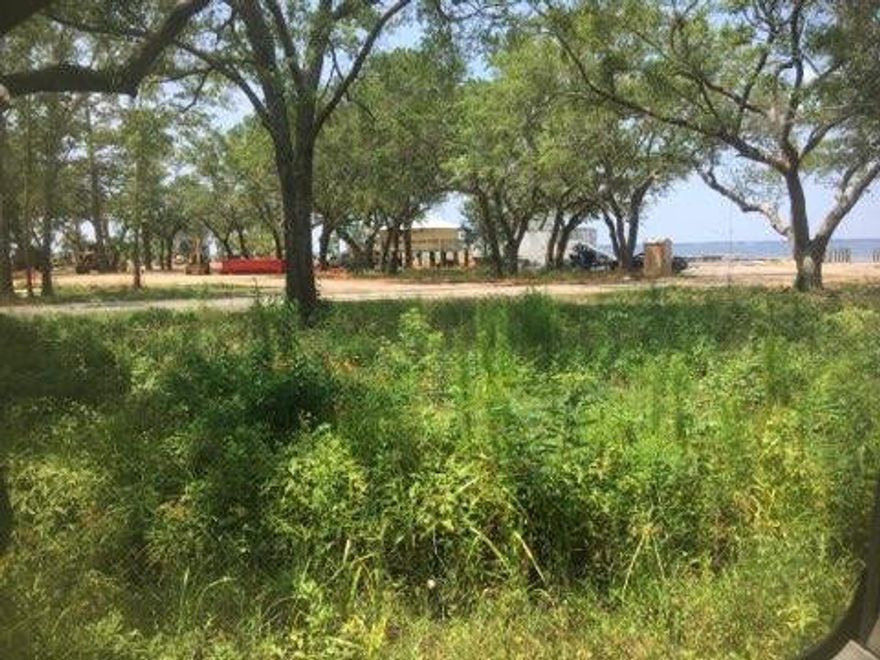 Possible water views from this wooded homesite which is directly across from Choctawhatchee Bay. New Walton County Bay Grove Park is scheduled to be complete summer of 2019 to include boat & kayak launches.