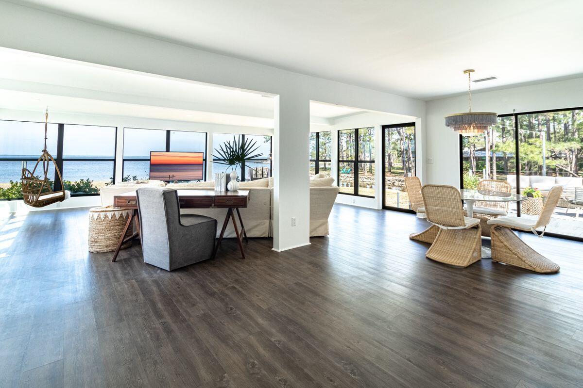 Contemporary coastal living on the bay seldom comes in a total package that includes a canopy of mature foliage, 400 feet of water frontage and a lovingly-restored bungalow with input from renowned architect Geoff Chick. Today's discerning buyer will appreciate a five-bedroom main home and artistic carriage home situated on nearly one acre on Choctawhatchee Bay, the perfect embodiment of privacy, luxury and Southern charm. Inspired by mid-century design, this elegantly furnished home offers luxury plank flooring throughout the living areas and hand-painted tile in each of its three baths. Timeless finishes in the kitchen and bath spaces are accented with custom lighting, classic fixtures and endless views of the bay from each of the home's four bedrooms.