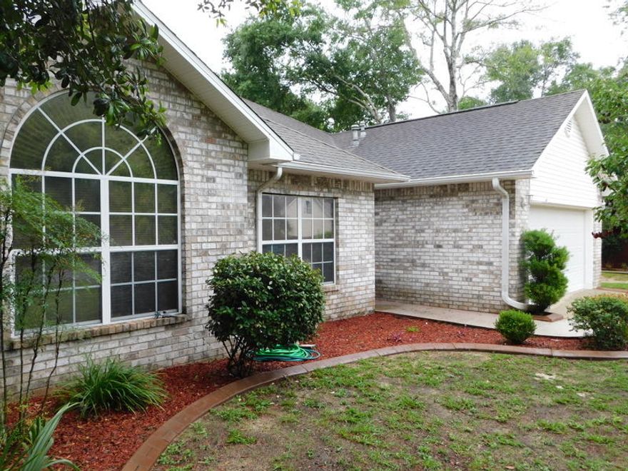 Excellent, South side location for an easy commute to the bases, shopping and the shores along the Emerald Coast. This ranch style home sits on nearly a half of an acre with room for a garden, workshop etc. Inside, you will enjoy the nearly new flooring and paint. Vaulted and trayed ceilings, gas fireplace, open floor plan and plenty of natural light. The kitchen is open to the great room and is light and bright. Outside , there is a large, level lot, an in ground sprinkler system, privacy fencing, a screened patio and mature landscaping. The rear fence is about 100 feet inside the actual property line. There is a 2 car garage and overhead storage. The sellers are offering a one year home warranty and this home is in ''turn key '' condition . Come by and look before this home is SOLD!!