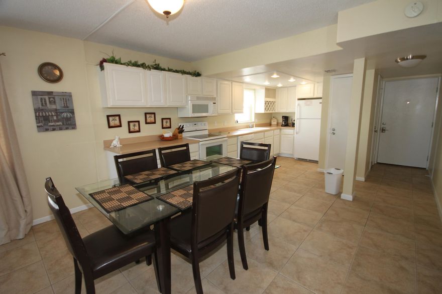 This Beautiful End unit is a MUST SEE!!! You will have incredible balcony view over the lush landscape to the Gulf of Mexico and its sugar white sand and emerald blue water. This unit has more windows for additional light and multiple views which will include gorgeous sunsets. Beautifully remodeled with an open concept kitchen with plenty of cabinets for storage. Tiled through out. This unit has been redecorated with most of the furniture and appliances being new. The unit has a New HVAC that was installed in 2012.This unit is centered between two pools with one being heated in the winter, tennis courts, Basketball court, Sauna, hot tub, fitness center and 24 hr. Security. All of this placed on 10+ acre lawn. Enjoy the miles and miles of uninhabited beach to the west. You would never