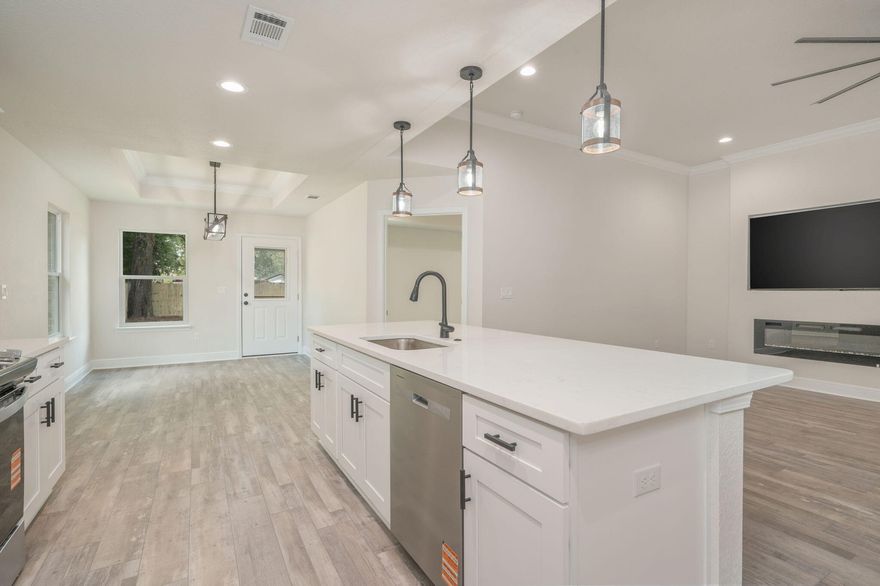 *CLOSING COST HELP AVAILABLE, JUST ASK!!ALEXA BUY THIS HOUSE!! If you seek quality affordable luxury, then honey stop the car! This home is 8 miles from Dukefield, 20 Miles from Eglin AFB, less than 1 mile from Downtown Crestview Fun and Food Trucks and the City Municipal Park! The builders thought of EVERYTHING like 10 ft ceiling living area,Trey ceiling in dining and master,Crown molding,75 in TV and 60 in fireplace,Cali grey ash LVP flooring,White Carrara quartz countertops,A real Irrigation system,All appliances w/ washer and dryer,Gutters, and a 6 ft privacy fence so anyway money for closing cost is really anyway money!! All this house needs are you as its new owner!! We want to stay up to date of what our buyers like and 9 out of 10 told us our homes just feel like home and that did it for us! Our mission is quality over quantity, and we nailed it!! Speak with your favorite realtor regarding a showing.