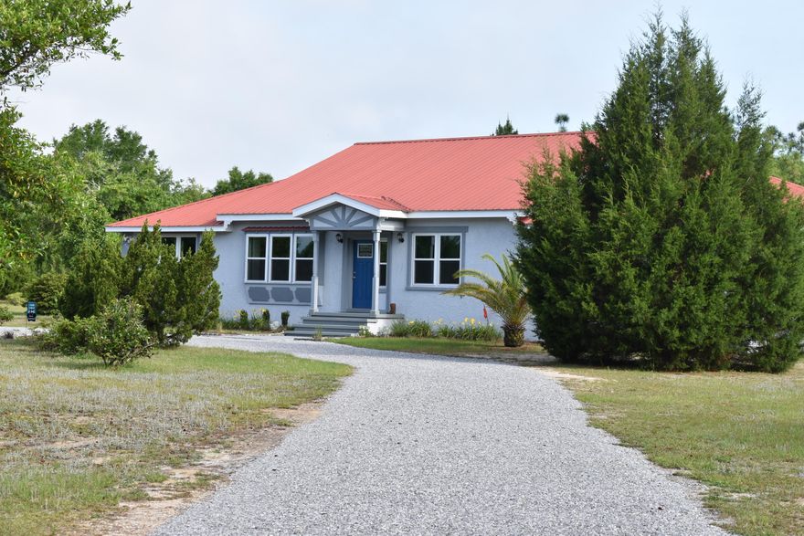 This large home rests on over 5 acres just off Hwy 331 and mins from Defuniak Springs and I-10! Fully fenced property with SOLAR powered entry gates on both ends of the circular driveway. NEW WINDOWS with lifetime transferable warranty! This home is over 2900 square feet and has 4 bedrooms and 2 full baths. TWO tankless water heaters. Parquet flooring can be found throughout the living room and family room. The family room also has a large fireplace. Large kitchen leads to tiled oversized sun room. *Sun room does not have HVAC. Home has a metal roof, stucco siding, and rests on a crawl space. A lot of home and a lot of land for the price. This property is sold as is.