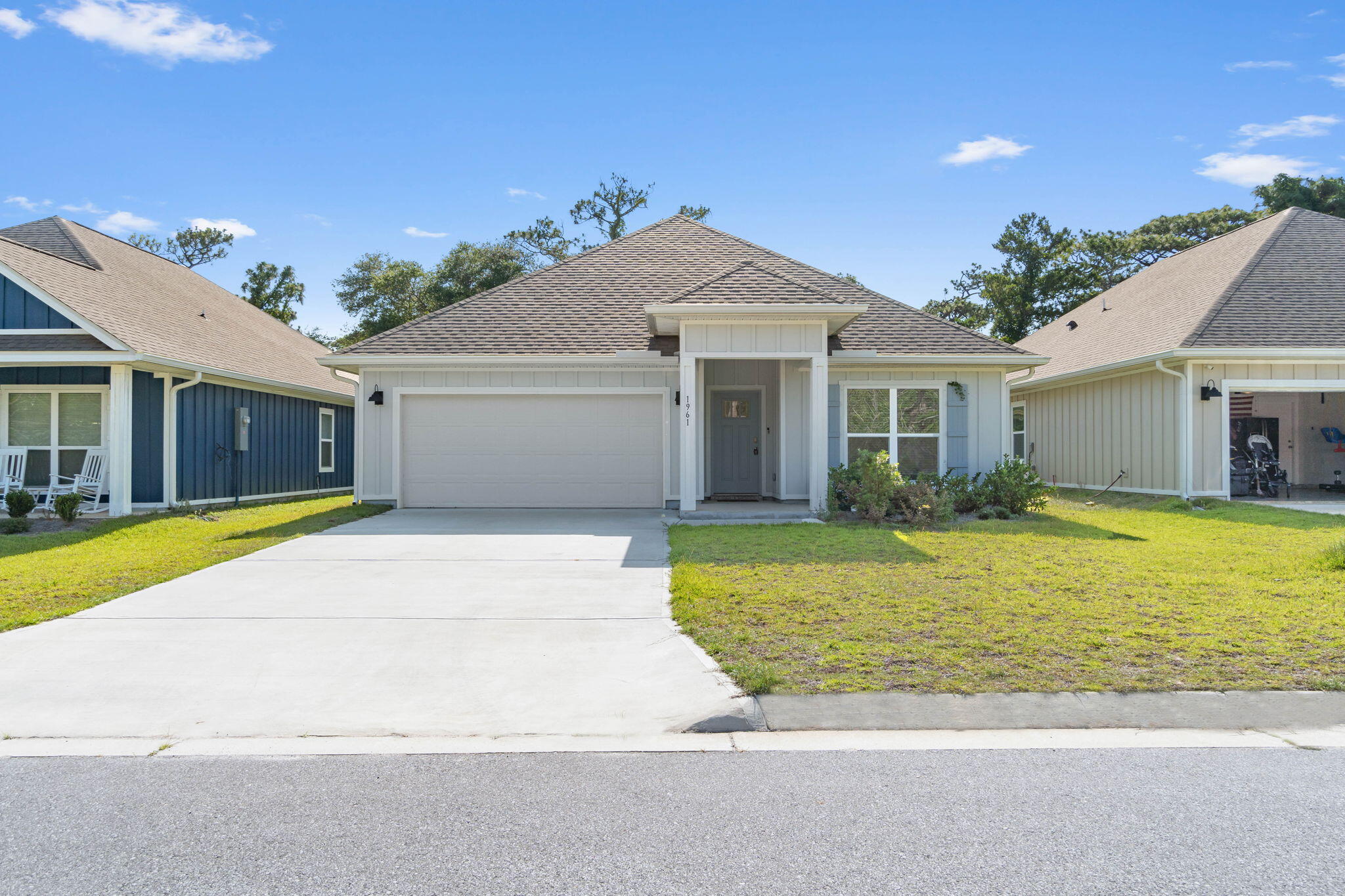 Enhance your lifestyle by making 1961 Noleka Court your next home, a stunning four-bedroom sanctuary located in the serene community of Navarre, FL. This charming residence boasts 1,768 square feet of thoughtfully designed space, perfect for hosting family gatherings or enjoying peaceful evenings. Step inside to discover an inviting open floor plan that seamlessly connects the living, dining, and kitchen areas, creating a warm and welcoming atmosphere. The two full bathrooms offer modern fixtures and ample space to cater to the needs of a busy household. Each bedroom provides a tranquil retreat, ensuring privacy and comfort for everyone. The surrounding neighborhood complements the home's appeal, offering a peaceful escape while still being conveniently located near local amenities.