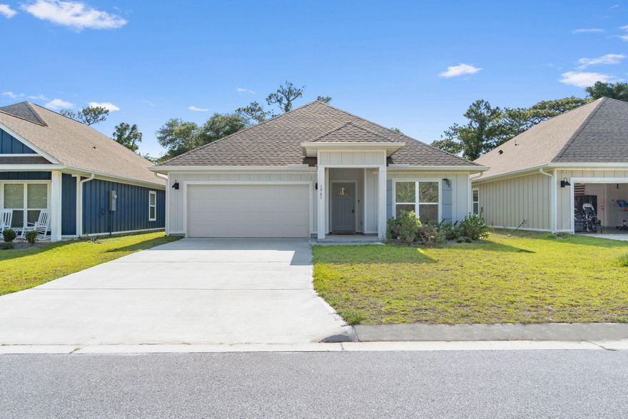 Enhance your lifestyle by making 1961 Noleka Court your next home, a stunning four-bedroom sanctuary located in the serene community of Navarre, FL. This charming residence boasts 1,768 square feet of thoughtfully designed space, perfect for hosting family gatherings or enjoying peaceful evenings. Step inside to discover an inviting open floor plan that seamlessly connects the living, dining, and kitchen areas, creating a warm and welcoming atmosphere. The two full bathrooms offer modern fixtures and ample space to cater to the needs of a busy household. Each bedroom provides a tranquil retreat, ensuring privacy and comfort for everyone. The surrounding neighborhood complements the home's appeal, offering a peaceful escape while still being conveniently located close to local amenities.