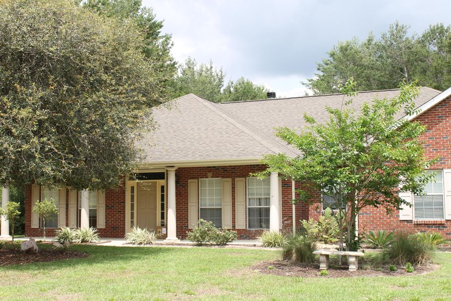 Beautiful home on one acre just minutes from town.