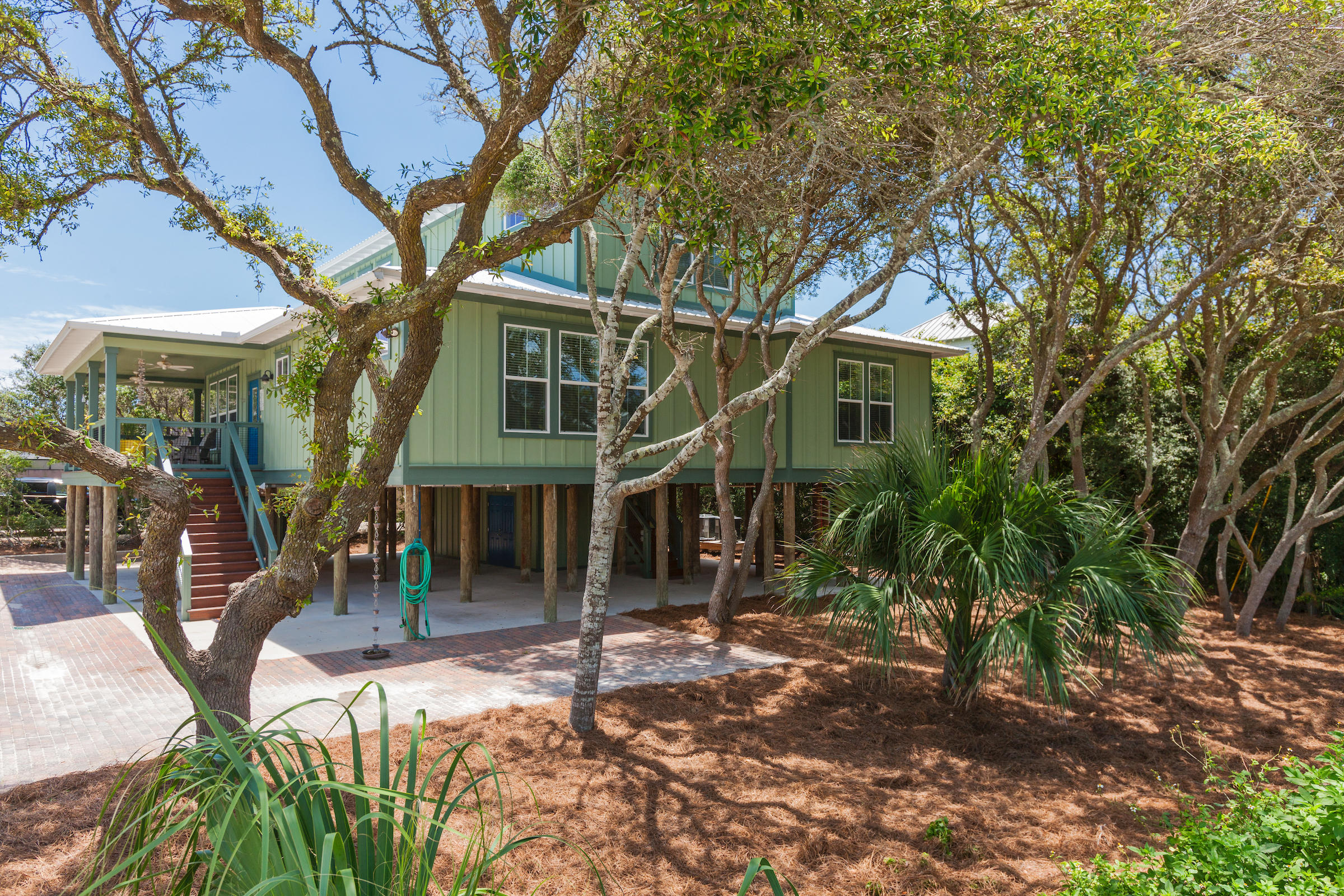 MAJOR PRICE REDUCTION! ROOM FOR POOL! $98K+ in rental projections. Seller is READY to move this adorable Florida beach cottage south of 30-A east near Alys Beach! MAKE YOUR OFFER! Built in 2013, this fully furnished custom built home is a hidden jewel in the coveted Seacrest area and is only steps away from the deeded beach access. The beautiful emerald waters and white sandy beach is your back yard and play area! Built on pilings, the first level features an outdoor open covered area for parking and entertaining and has a large walk in shower and large storage area for bicycles, beach chairs, tools etc. The 2nd level features the main living area with open floor plan featuring beautiful hard wood floors, wood nickle gap walls, stainless appliances, walk in pantry, large breakfast island with gas stove, farm style sink and eclectic old farm style themed cabinets with a beautiful back splash. This main living/kitchen/dining area opens to a large wrap around porch. Two of the 4 bedrooms are on this level. They are both large rooms with walk-in closets and attached en suites, one being the master bedroom with a large walk in tiled shower. A half bath and laundry room with attached owners closet completes the 2nd level. A wide custom wood staircase leads to the 3rd level with an abundance of windows for plenty of natural light. The 3rd bedroom is large with sitting area and attached full bath and faces south to a private porch with beautiful views of the Gulf of Mexico! The 4th bedroom features two large bunk beds and baby bed and has it's own attached full bathroom. Overall, this home sleeps 12 comfortably in beds, is turn key and would be a great rental/investment home. A very well built high quality solid home, it has many extra features with security system, tank less hot water, impact glass windows, wood pilings/concrete foundation, Galvalume roof, spray foam insulation underneath home for efficiency, hardi board siding and new exterior paint in 2017 to name a few. This lot is large enough for a hot tub or nice size pool, outdoor fire pit and more and could be fenced in if desired. NO HOA to deal with:) Don't miss out on this great beach home, call today to schedule a viewing! CHECK OUT 3-D WALK THROUGH TOUR IN PHOTOS ON THIS LISTING. Buyer should verify all data and dimensions. Survey is available to Buyer. Details coming on the pool;)