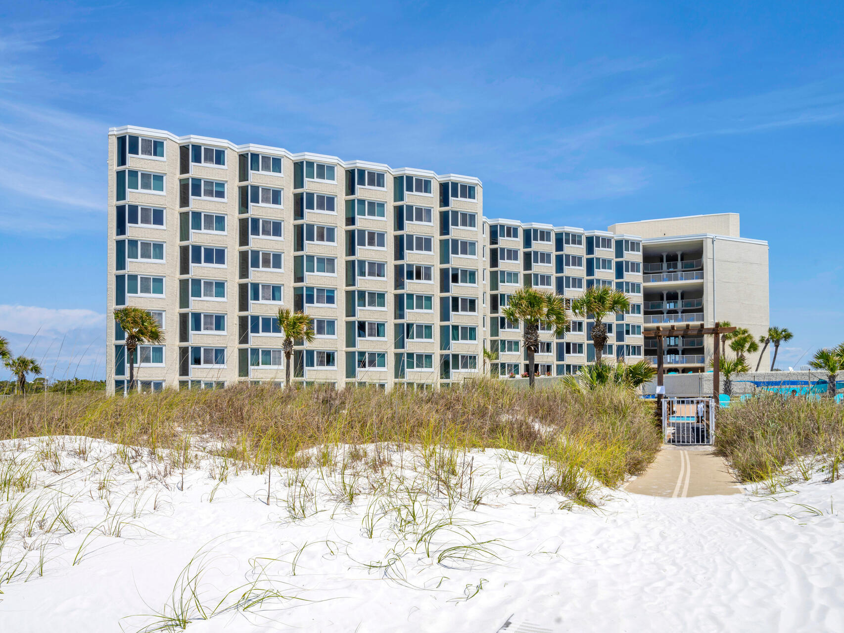 Welcome to this must see gorgeous turnkey first floor vacation rental unit that is beautifully updated and decorated. This unit has a great patio for outdoor entertaining and convenient to the pool/amenities/beach! Updates include new flooring, bathroom, HVAC & hot water heater in 2022, kitchen including new countertops, backsplash, stove & refrigerator. Top of the Gulf has completed extensive updates including windows, doors, handicap accessible ramp to beach and exterior floor epoxy. Top of the Gulf has wonderful amenities including a spacious pool, tiki bar, sun decks, shuffle board, fitness center & game room.