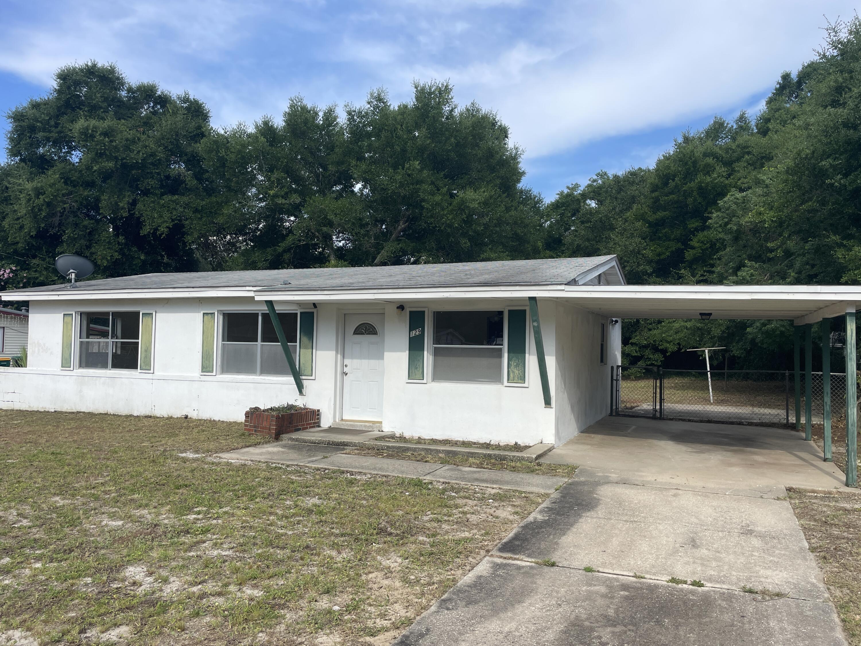 AMAZING opportunity to steal this Mary Esther home for under $200K! WOW! Located in the heart of Mary Esther, this 3 Bedroom / 1 Bathroom home is the perfect mid-century fixer-upper for you to either make it your own, flip it or keep as an investment property! This is the perfect opportunity for you to put in some elbow grease and end up with a stellar property and a ton of equity! HUGE fenced-in backyard, carport, and a pink bathroom that will definitely be a conversation starter. ;) Not to mention just a 5-minute walk across the street to the public dock and boat ramp! Great bones and foundation on this one - It's perfect for the 'do-it-yourselfer'. Don't wait because at this price it definitely WILL NOT LAST LONG! **CASH OR CONVENTIONAL BUYERS ONLY**
