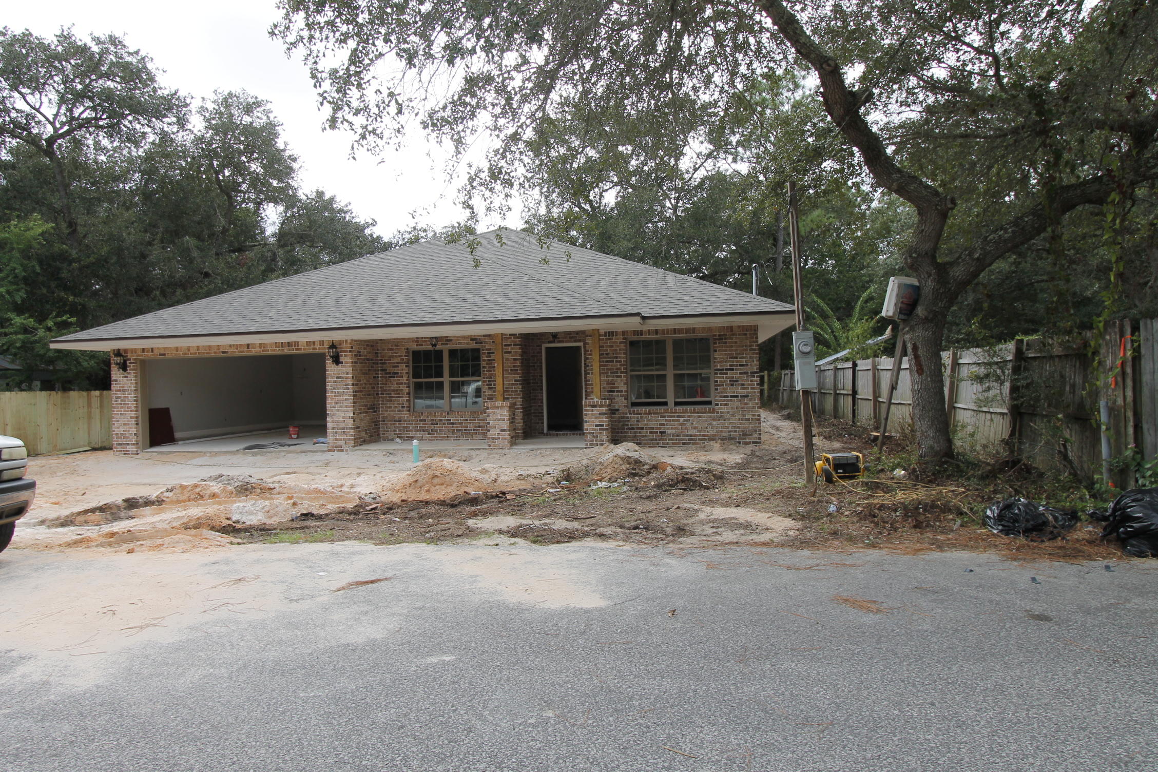 Brand new construction started in August 2017. Awesome floor plan by multiple award winning builder and past Parade of Homes winner! This 4/2 custom brick home has super curb appeal. There are 10 ft. ceilings w/ impressive crown molding, tile flooring, and 5 1/4'' baseboard throughout the main living areas. As you approach the front of the home, you will be quite impressed. The covered porch is very welcoming, and the leaded glass door, makes for a grand entrance. The formal dining room is at the left of the home's front. You will then enter the chef's delight kitchen will which boast maple cabinetry, granite countertops, a huge pantry, a storage closet, and stainless appliances. At the right of the home's entrance is bedroom one, continuing down the hallway is the guest bath, then bedroom two. The oversized greatroom is in the rear of the home. The master suite is oversized, has 2 walk - in closets, a walk - in shower, a whirlpool garden tub, and a double vanity. The laundry room is at the rear of the kitchen, and has a door which opens to the garage. The yard is beautifully landscaped and comes complete w/ a well, sprinkler system and timer. Insurance will be very reasonable, as home is built to today's code and plywood window coverings are being provided for storm protection. Home has a Taexx ''in the wall'' pest control system that is serviced from the exterior of the home, for owner's convenience. Completion expected in late October. Listing Broker/Salesperson has equitable interest in the property.