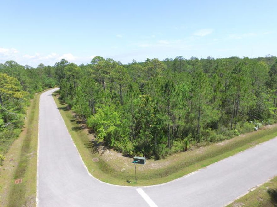 Beautiful corner lot located in the private community of Seclusion Bay. Low HOA fees and Bay Access! At 1.08 acres you have plenty of room to build and still have lots of beautiful landscaping