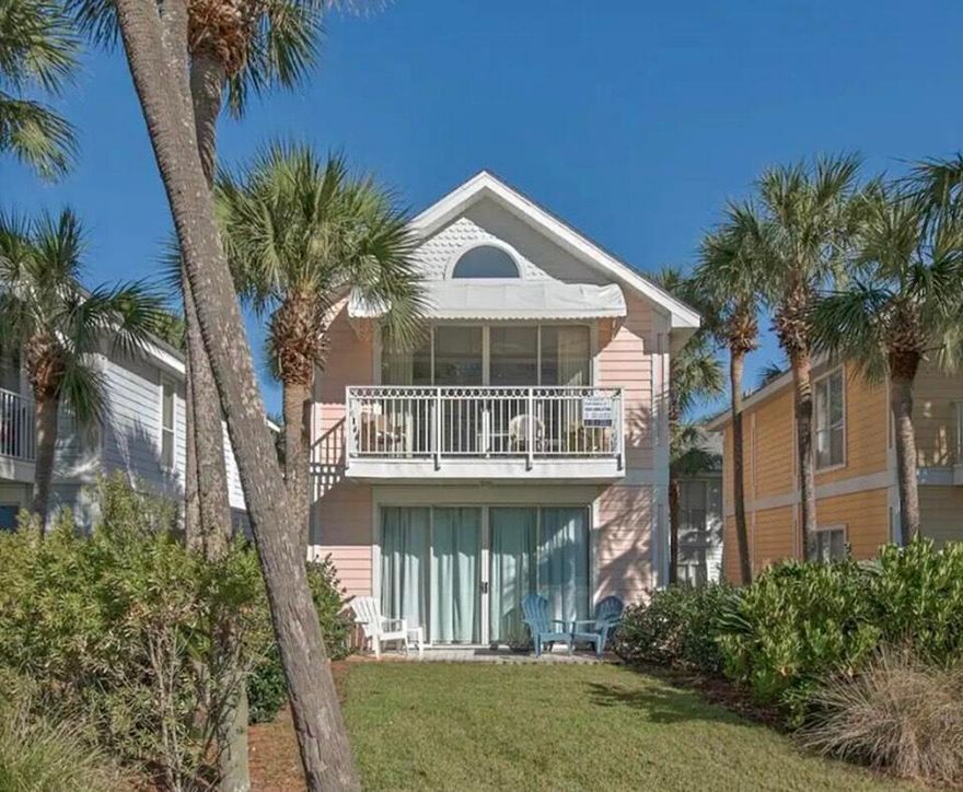 BEST DEAL IN CRYSTAL BEACH with lowered 2024 HOA costs!! 
This Florida Cottage Home located in the desired Crystal Beach area has two separate ''Lock-Out'' Units and is right across the street from from the Gulf of Mexico and our incredible White Sand Beaches.  The Home has 'Gulf Views' from the 2nd Floor Balcony.  This Home is perfect for someone looking for a 2nd Home Retreat or as an Investment Short-Term Rental.  Each Unit (A & B) consists of one Bedroom, one full Bathroom, and a Bunk Room as well as a Kitchen, Living/Dining area and a private Balcony and Patio.  This Home will be delivered fully furnished/rental ready with proven Rental Income delivering a really nice Return on Investment.  A Community Pool and Laundry Facility along with having two convenient Beach Access location