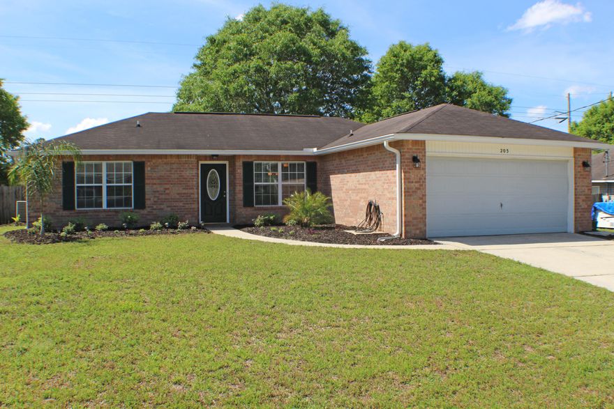 Everything has been perfectly updated! As you enter this home there is a small foyer opening up to the living room with big windows letting in natural light. On the left wing of this home are your two additional bedrooms that share a full, hall bathroom. The living room wraps around leading to the dining area overlooking the kitchen. Stainless steel appliances, quartz island with wall accent, tons of counter top space, and a large single bowl sink with beautiful accenting backsplash. The dining area has a sliding glass door letting in more natural light and giving you access to your open, paved patio area. On this wing of the home is the laundry room with garage access. Across the hallways is your large master suite with double vanity sinks in the bathroom and custom walk-in closet space.