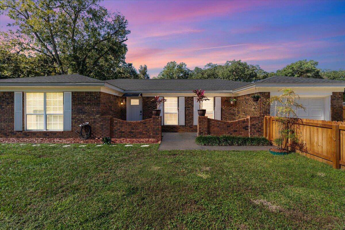 OPEN HOUSE 12/07/24 11-2!Welcome to 107 Tomahawk Trail, nestled in the heart of Pensacola, FL. This exquisite brick house, WITH A SEPARATE APARTMENT, newly renovated from top to bottom, is the perfect setting.  Step through the front door and be greeted by stunning wood-look vinyl plank flooring that flows seamlessly throughout the entire home, paired with fresh, neutral paint that sets a tranquil tone for all your large gatherings. The spacious living areas are highlighted by elegant crown molding, creating a refined atmosphere that's both inviting and comfortable. The large family room is an ideal space for entertaining or unwinding with loved ones, while the expansive kitchen serves as the heart of the home. It boasts ample counter space and an abundance of cabinets to store all your culinary essentials. Remodeled bathrooms feature stylish tile showers, adding a touch of luxury and ease to your daily routine. The primary suite is a private haven, complete with glass sliding doors that open to the serene backyard, inviting the beauty of the outdoors in. Additionally, this home includes a Mother-In-Law Suite with a private entry, offering comfort and privacy for extended family or guests. With four generous bedrooms, two bathrooms, and parking for up to four vehicles, space is plentiful. But wait!  There's so much more!  A completely remodeled two-story apartment!  Presenting a remarkable chance for investors to obtain a turnkey property in a sought-after location. Spanning approximately 600 square feet, this sleek unit is thoughtfully designed with modern living in mind. The lower level invites guests with a spacious living area that sets the stage for relaxation or entertaining. The layout flows seamlessly, offering a bright and airy ambiance that tenants will adore. Ascending to the upper level, the tranquil bedroom awaits as a private retreat. With ample space to rest and rejuvenate, it's the perfect end-of-day escape. The apartment boasts a full bathroom, meticulously appointed with contemporary fixtures and finishes that add a touch of elegance to the functional space. Investors will appreciate the separate entry to the apartment, enhancing privacy and the appeal to prospective renters. The property sits on a substantial .23-acre lot, complete with fenced front and backyards that ensure privacy and safety. Located just minutes from Pensacola NAS and about 20 minutes to the stunning Pensacola Beach, this home is perfectly positioned for convenience and leisure. Whether it's the allure of a brand new roof, the practicality of a large layout, or the charm of the neighborhood, 107 Tomahawk Trail is a place where memories are waiting to be made. Don't miss the opportunity to make this house your forever home.  Buyer to verify items of importance such as room sizes, school zones and utility services.