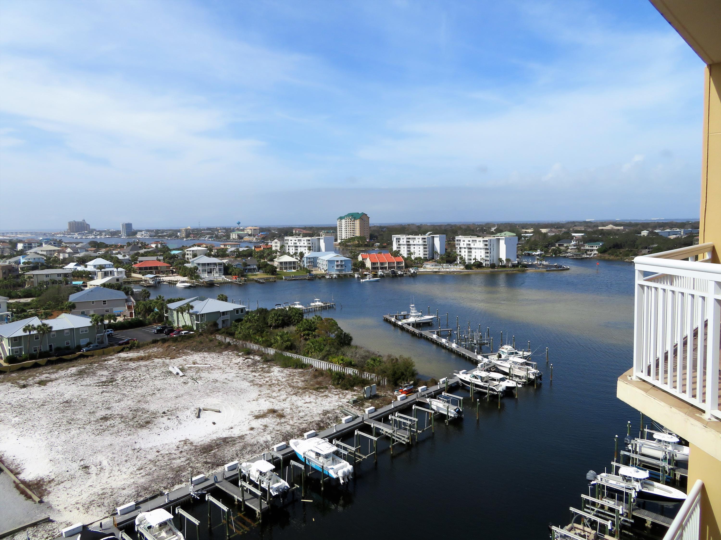 Luxury condo living at its best, this 2 bed 2 bath floor plan at Harbor Landing delivers A large western facing covered balcony with amazing views of the Gulf of Mexico and Destin Harbor. This gorgeous fully furnished unit is a Perfect boaters dream offering the ultimate best of both worlds, sitting on a peaceful harbor location yet directly across from Destin's beaches with convenient gated deeded beach access. The Master bedroom offers its own Spectacular View, wake up in the morning and gaze out at the beautiful white sands and emerald waters. Master bath is complete with a garden, jetted tub and separate glassed-in shower. Beautiful Tile throughout the expansive living, kitchen and dining areas. Unique ceiling features, and crown molding create architectural interest. The detail and