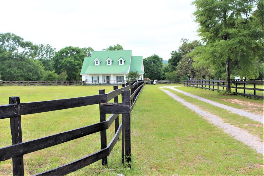 Country Living right out of a magazine. Horses and farm animals are welcome on this beautiful & expansive property with over 11 acres to enjoy. Surround yourself with the peace and tranquility of the country & only 15 min. to town. One of the best features of the home is the complete privacy for you and your family with INCREDIBLE views overlooking the saltwater pool and deck area. With so much beauty, you will be tempted to just enjoy a 'stacation' with the family.  The sellers were meticulous with maintaining and upgrading the home inside & out. The flooring throughout the downstairs is African Sandstone tile and hard woods which extend up the stairs and throughout the  open loft area. The media/gym room has Pergo flooring and the upstairs bedrooms have plush carpet. You will love the fresh Sherman Williams Cashmere paint throughout the entire interior of the home plus the outside deck area, doorways, front porch and covered back porch, and the barn siding.  Another great feature of the home is the spray foam insulation done in February of 2021 and goes throughout attic, entire 2nd story ceiling & even down the side of the pantry. This translates to greater comfort year around and  much lower power bills. The large walk-in attic is climate controlled and is as comfortable as the rest of the home. More features include convenient Electrolux central vacuum for 1st floor, gas fireplace with built in cabinetry, all brand NEW light fixtures and fans throughout, crown molding, NEW stove, NEW bathroom mirrors, NEW door leading out of office area that will be installed prior to closing, All stainless steel appliances, newly painted kitchen cabinets, upstairs exterior deck wood was removed and repaired with top cover installed so that you can enjoy the beautiful views worry free, Ecobee controls were installed in February of 2021 with dual zones on 1st floor and 2 separate thermostats for complete comfort. NEW drain field to be installed in the next few weeks, septic tank recently inspected & pumped, heat pump for downstairs was replaced in 2017 and upstairs was replaced in 2019, back porch was painted and screened in, composite decking was added around the back deck area and new rails were replaced in April of 2021, Well AND City water available so you have access to either and ensures you never run out of water, practice target range, 4 stalls for your horses PLUS hay room, 60 x 12 foot run in area for storage, huge covered storage area for your RV and boat, DREAM OVERSIZED GARAGE/BARN OUT BUILDING with tons of space for all of your outdoor toys and equipment, The barn and spacious garage have plenty of space for vehicles, tractors, RV's, etc with lots of shelves to keep everything organized. There's even an In-law suite attached for overflow company. There are so many features and upgrades in this immaculate home and the owner has insured that it is TURNKEY READY for you. This beautiful home is ready for your family.  Come check it out today! All measurements to be verified by the buyer.