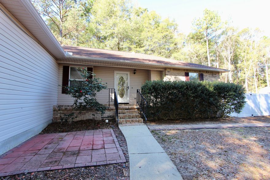 Situated on a peaceful 1-acre lot in Crestview, this well-maintained 3-bedroom, 2-bathroom home offers both comfort and functionality. The partially privacy-fenced backyard includes gated access and an additional smaller fenced area, ideal for pets, gardening, or added privacy.The property features a freshly mulched and cleared yard, a bonus storage area, and a relaxing hot tub. An air-conditioned shed provides flexible space for a workshop or studio, while an additional utility shed offers ample storage for tools and equipment.Interior updates include new flooring in the primary bedroom and a brand-new water heater. Major systems have been updated with an AC installed in 2018 and a roof replaced in 2021. The garage is pre-wired for an electric vehicle (EV) charging station. This This property offers a great combination of space, updates, and versatility.