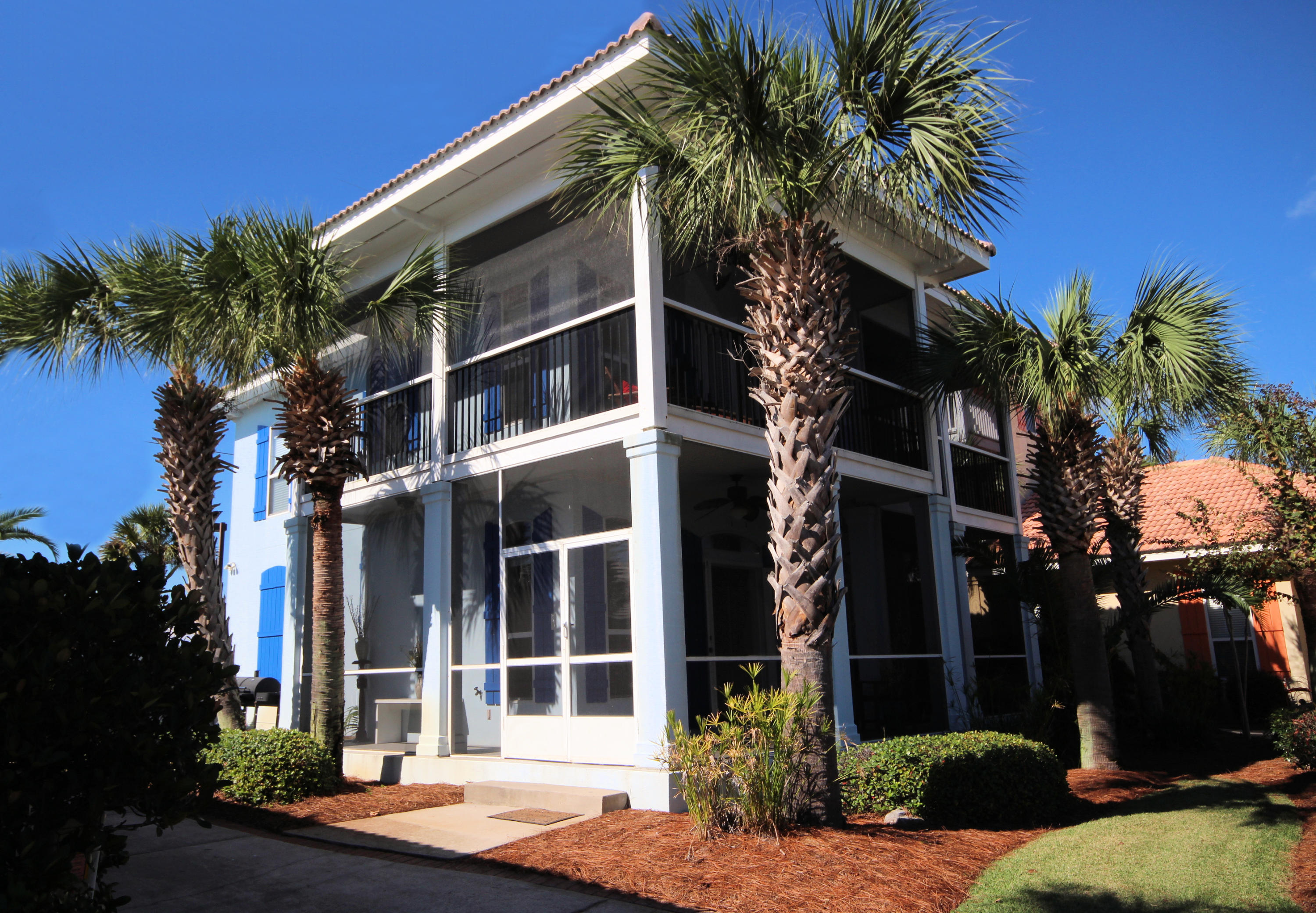 Four sets of French Doors lead to upper and lower screened ''wrap around'' porches. From the moment you enter you will understand why this home is named ''Southern Charm''. Large kitchen ideal for gatherings features blue Corian Counters, abundant cabinets, crown molding, and a breakfast bar adjoining large 15'x 31' living/dining area. Large ceramic tile flooring throughout downstairs for ease of maintenance. Cook on the grill and enjoy Gulf breezes while dining on the porch. Soak in large jetted tub in oversize master bath. ''Bunk room'' area also leads to screened porch upstairs. Emerald Shores neighborhood features a private Community beach pavilion located on the white sandy beaches and Emerald green water of the Gulf of Mexico. Swimming pools, tennis courts and a clubhouse nearby.