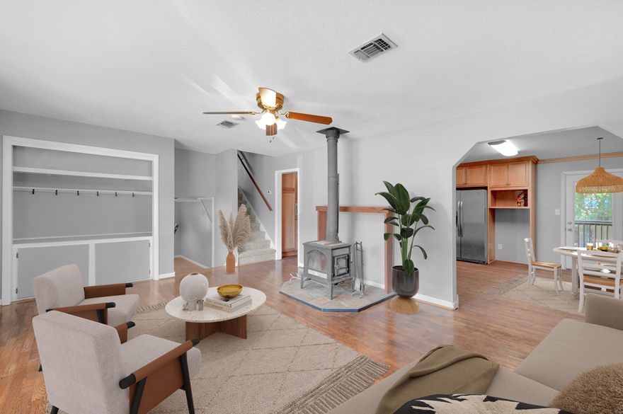 NEW PRICE! MOTIVATED SELLER WILL HELP WITH CREDIT FOR CLOSING COSTS AND/OR INTEREST RATE BUY DOWN*As you enter the home, you cannot help notice the refinished, Red Oak Hardwood Floors along with the space that abounds over the split levels. Check out the Kitchen, it's a Chef's delight with lovely Maple, soft close Cabinets, newer Stainless Appliances, including a Gas Stove; solid surface counters and a huge breakfast bar, just perfect for entertaining... They say the best parties are always in the kitchen! Both bathrooms have been recently updated too. Add to this a big fully fenced yard with a screened in porch, open deck and Patio with Pergola - and perhaps that party should be outside, after all! Additional features include a Tankless Water Heater, Hurricane shutters, sprinklers,