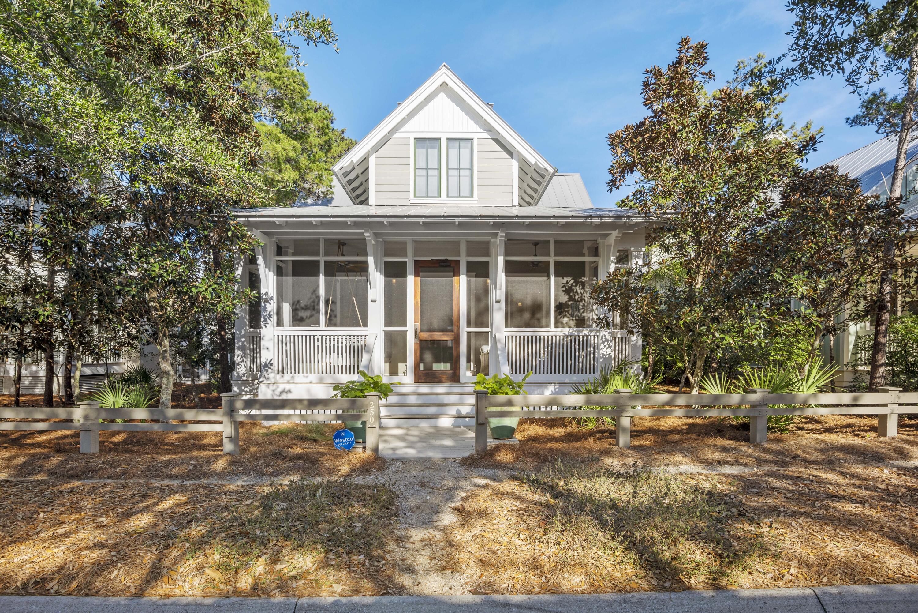 This charming coastal retreat is prominently located in the desirable Lake District of WaterColor. Boasting 4 bedrooms and 4.5 bathrooms, the home provides both ample space to host and entertain guests and enough privacy for a cozy personal oasis. Upon entering the home, you are welcomed to the open living space with raised ceilings, shiplap walls and carefully designed finishes and decor. Both the dining and living room open to the gourmet chef's kitchen featuring a Wolf gas cooktop, Subzero fridge/freezer, breakfast bar, center island, and granite countertops. Each room has been thoughtfully redesigned and decorated to reflect a modern coastal style. The home also includes upgraded features such as hurricane shutters, hardwoods throughout, an upstairs den, TV area, and bunk room. Moving