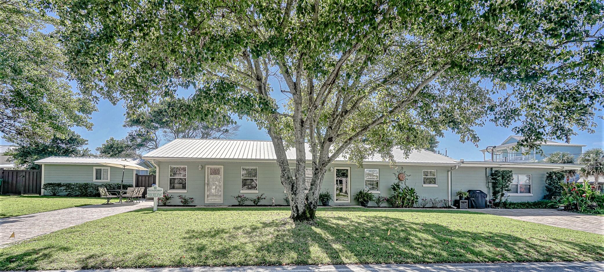 This exquisite triplex in the highly desirable Crystal Beach neighborhood of Destin has good rental history. The potential is more than double the recent history due to significant owner use over the past few years. The two 1 bed/1bath units are on a vacation rental program. The larger, 2bed/1.5 bath unit is currently for owner use. Nothing was overlooked in the remodeling of this solidly built concrete block home. Metal roof, upgraded electrical, plumbing, windows, and insulation give this triplex the perfect combination of storm safety and energy efficiency. High and dry, this property rests in Flood Zone X. This upscale rental, one block off of Scenic Hwy 98, will provide steady cash flow in its current condition and a future opportunity for a large single family residence.