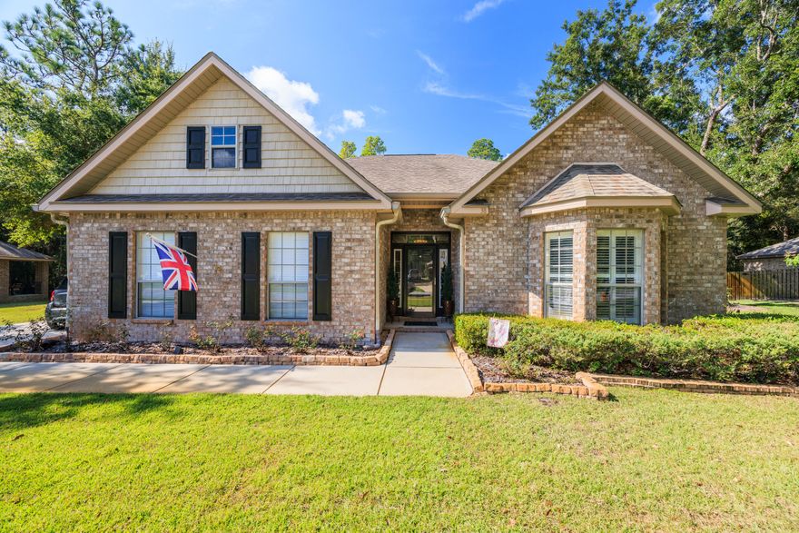 This home truly has it all--and it's ready for you to move right in. Sellers have completed approx. $35K in upgrades in the last three years.Tucked away in the Gardens neighborhood of renowned Hammock Bay community, this beautifully upgraded 3-bedroom, 2-bath  home features a low-maintenance brick exterior and sits on a generous lot backing up to preserved green space, offering privacy, peaceful views, fresh air and tranquility. Step inside and you will immediately notice the care and attention to detail. Fresh interior paint and rich laminate wood flooring run throughout all living areas and bedrooms--no carpet anywhere. The sun-room, with its elegant French doors and tile flooring, is the perfect spot to relax. The kitchen is a standout, featuring granite countertops, upgraded lighting, and a full suite of new KitchenAid appliances--dishwasher, stove, microwave plus an LG refrigerator. Every window features custom plantation shutters and new chandeliers add a touch of style throughout the home. The master suite offers a quiet retreat with a separate tiled shower, a tub and dual vanities. Two additional bedrooms, on the opposite side of the home, provide space for guests, family, or a home office. 

And when it's time to unwind outdoors, you'll love the recently extended brick paver patio--perfect for cozy evenings under the stars. The landscaping is beautifully maintained, and the automatic sprinkler system keeps everything looking fresh with minimal effort.

The side-entry 2-car garage includes a pull-down ladder to a large, floored attic space, giving you tons of extra storage.

Additional upgrades include phantom screen doors, leaf filter gutter guards, tree trimming, a new we l pump and filter, and a new HVAC system (2023)--all totaling approximately $35,000 in improvements.

The location of this home offers the perfect blend of privacy and accessibility. Hammock Bay offers resort-style living with pools, fitness center, tennis & pickle-ball courts, playgrounds, walking trails, a fishing pier, clubhouse, and event spaces. You're just minutes from Publix and top-rated schools, with easy access to the white sands of 30A, South Walton's dining and shopping, Destin's entertainment, Panama City Beach, Eglin and Hurlburt Air Force Bases, and major airports. Low-maintenance, thoughtfully upgraded, and full of charmthis Hammock Bay gem is ready to welcome you home. 
Schedule your showing today!