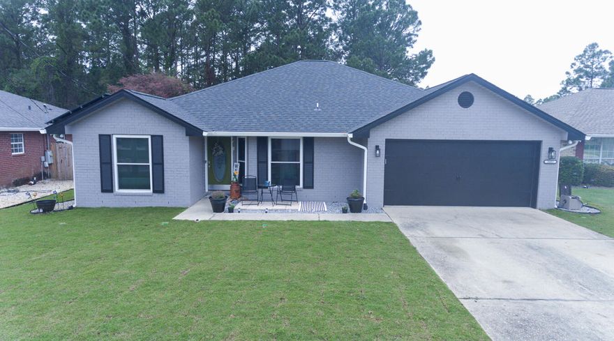 Welcome to this beautifully updated 4-bedroom, 2-bathroom home in the heart of Navarre. Designed for modern living, this home features a net-metered solar system that keeps energy costs low, while countless upgrades provide comfort and style.Step inside to enjoy a bright, open floor plan with abundant natural light. The renovated bathrooms boast sleek, modern finishes, while the new flooring and smooth ceilings add a fresh, contemporary feel. The spacious primary suite offers his and hers walk-in closets with built-ins and a luxurious, recently remodeled ensuite bathroom. The kitchen shines with LG stainless steel appliances, a generous center island, and plenty of storage. Relax in the comfortable living room or host elegant dinners in the formal dining area. Additional conveniences include a tankless gas water heater (2024), new windows (2023), and a new roof (2020).

For those who enjoy year-round comfort, the garage features a mini-split A/C unit, an insulated door, and a radiant heat barrier in the attic. Outside, the backyard is a serene escape within a privacy fence. Landscaping includes new sod (front), French drains (2024), and a sprinkler system on a private wellkeeping your yard green without the extra water bill.

This home also includes a transferable termite bond for added peace of mind. Stay connected with lightning-fast fiber internet, and enjoy enhanced security with a hardwired system and high-quality cameras.

This home's location is unbeatable, nestled in a quiet, family-friendly neighborhood just 7 minutes from the beach. It's also convenient to Hurlburt Field Air Force Base, Hidden Creek Golf Course, schools, and local shopping.

Experience sustainable living without compromising on luxury. Schedule your private tour today and see why this solar-powered gem is the perfect place to call home!

